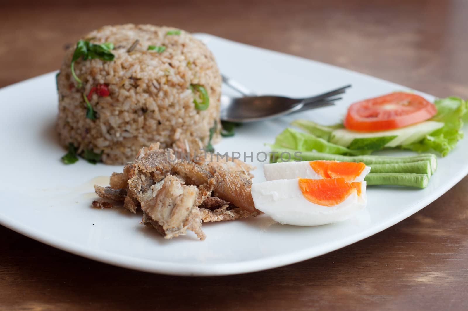 spicy fried rice with fried fish with salted egg