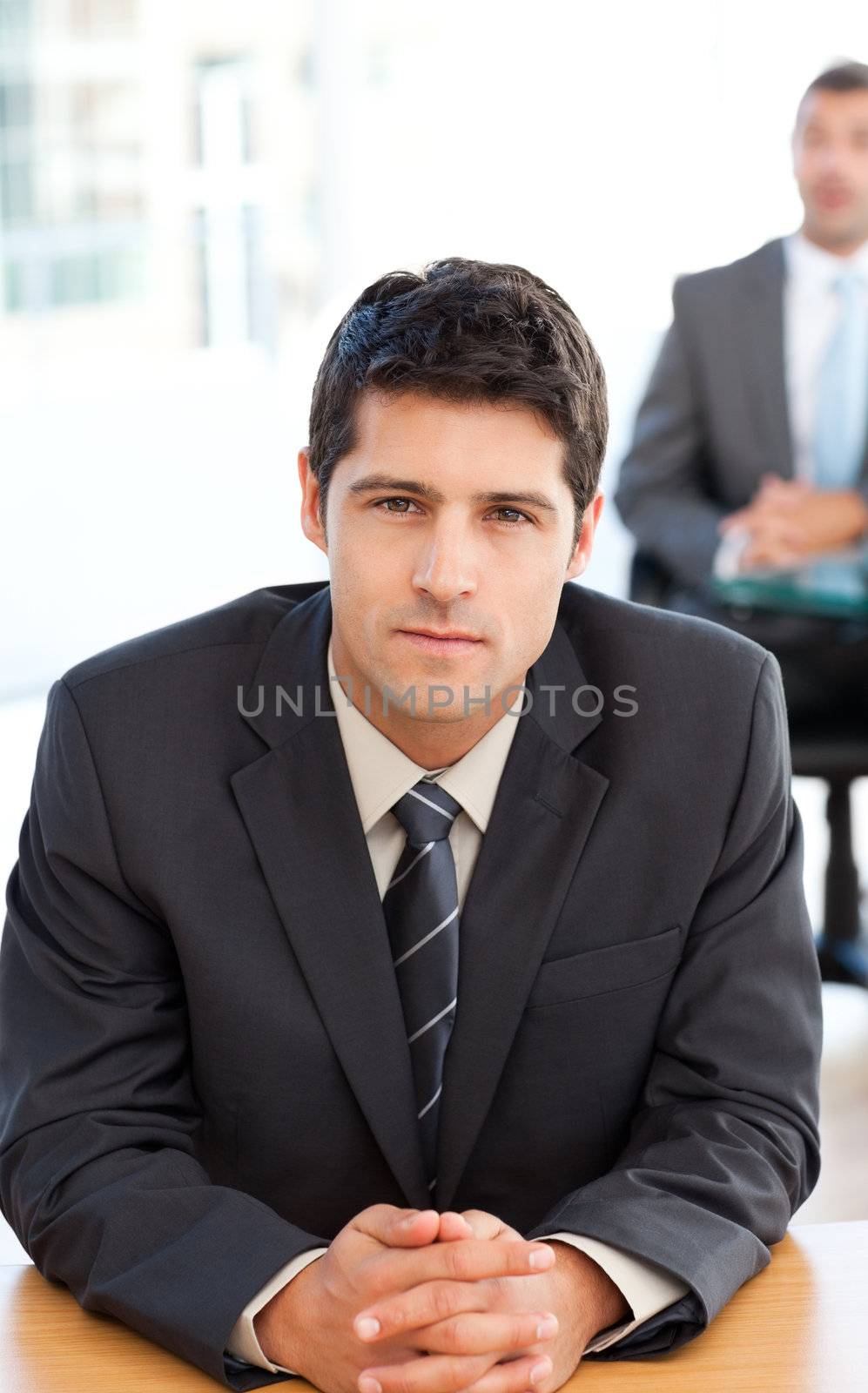 Concentrated businessman during a meeting with a colleague at the office