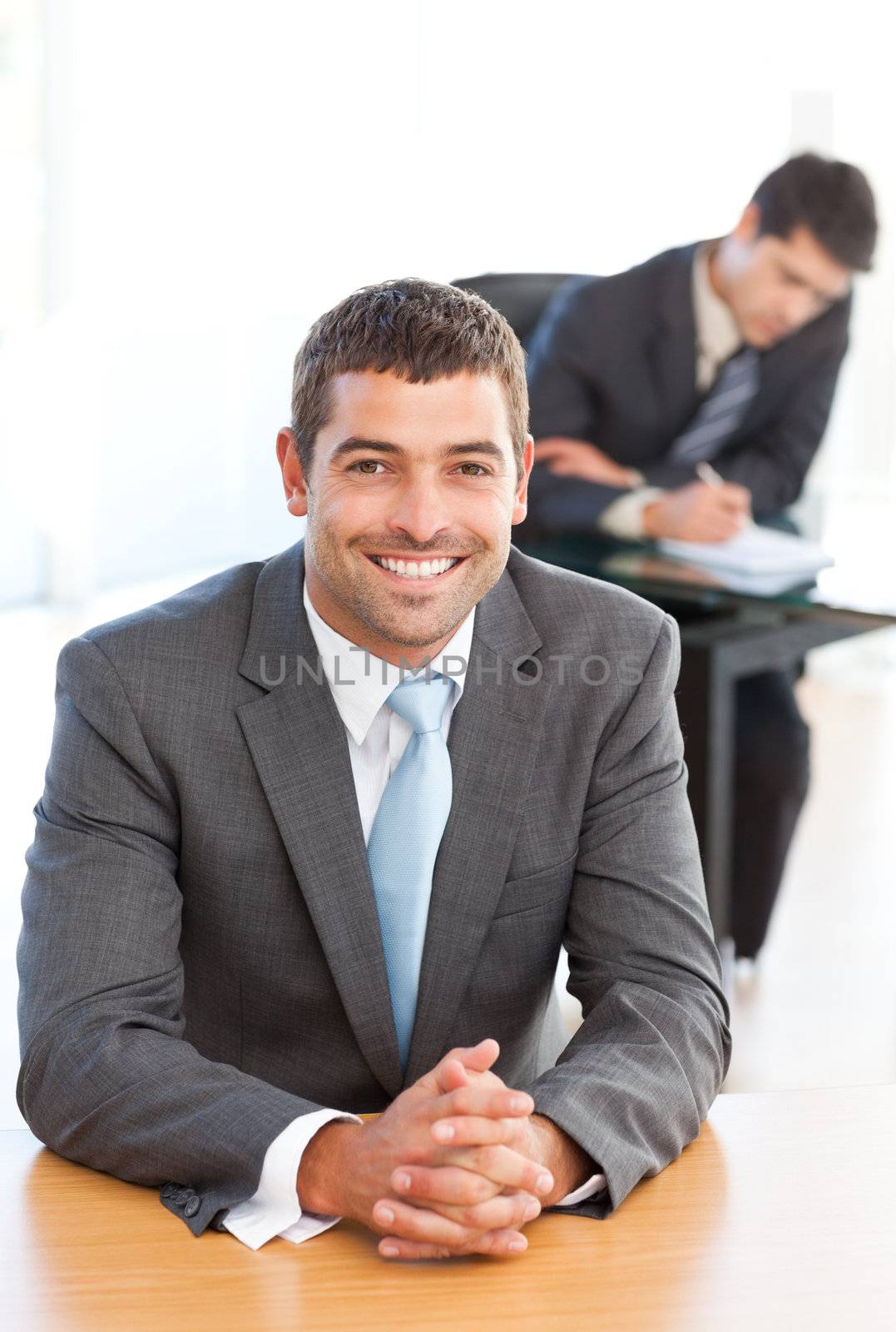 Cheerful businessman during a meeting with a colleague by Wavebreakmedia