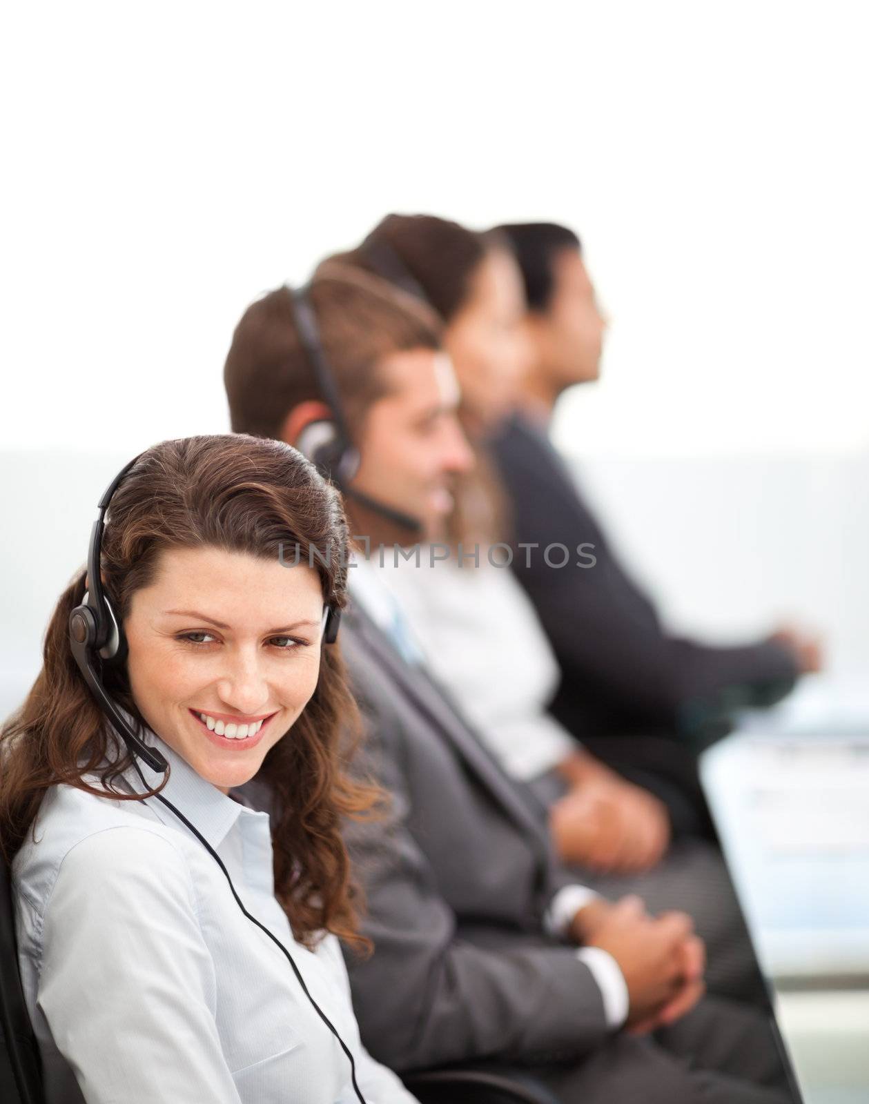 Pretty representative with working in a call center with her colleagues