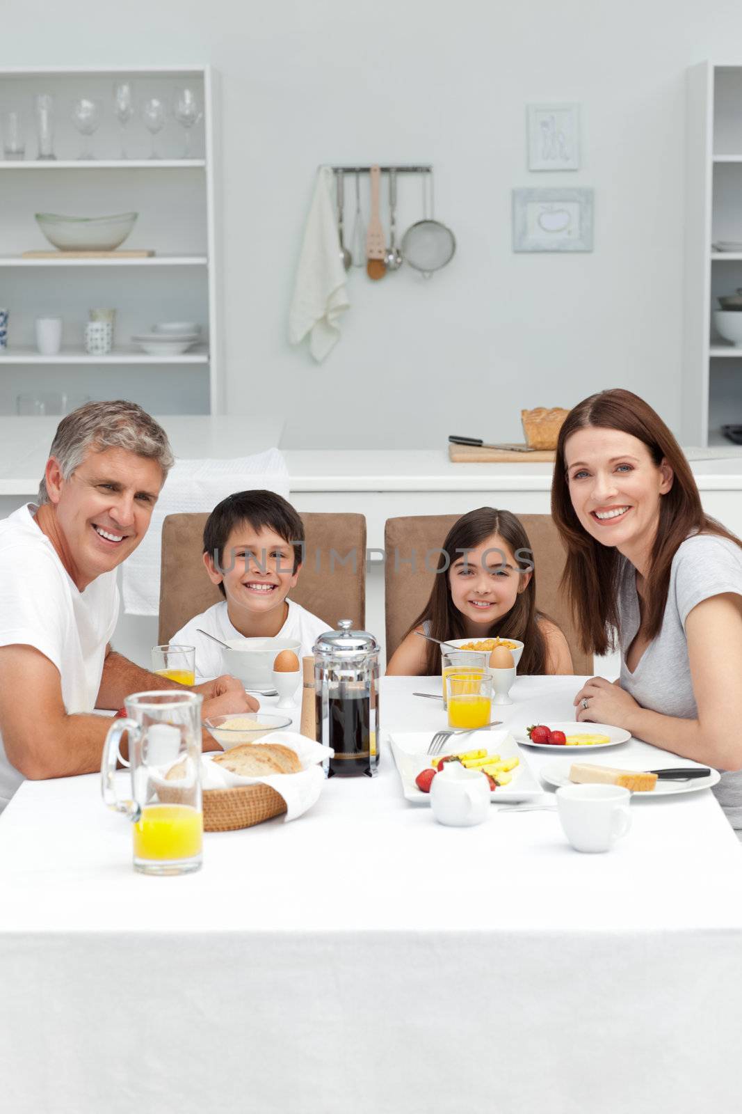 Family having breakfast in the kitchen by Wavebreakmedia