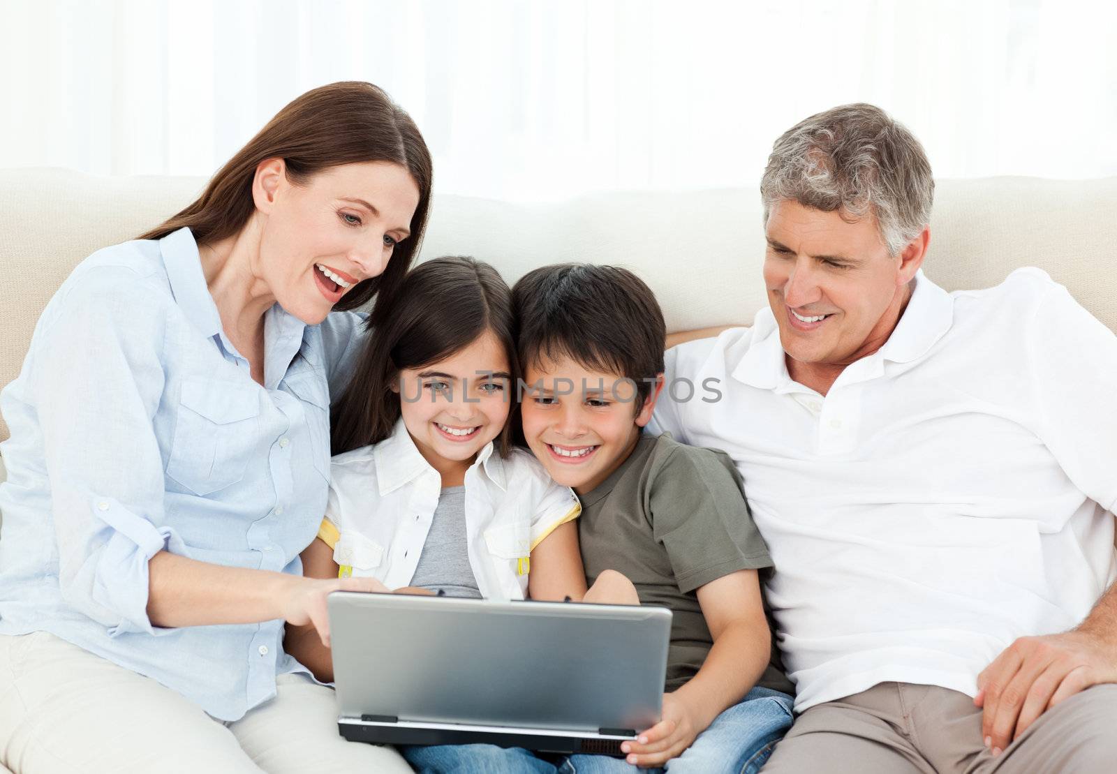 Family looking at  the laptop at home