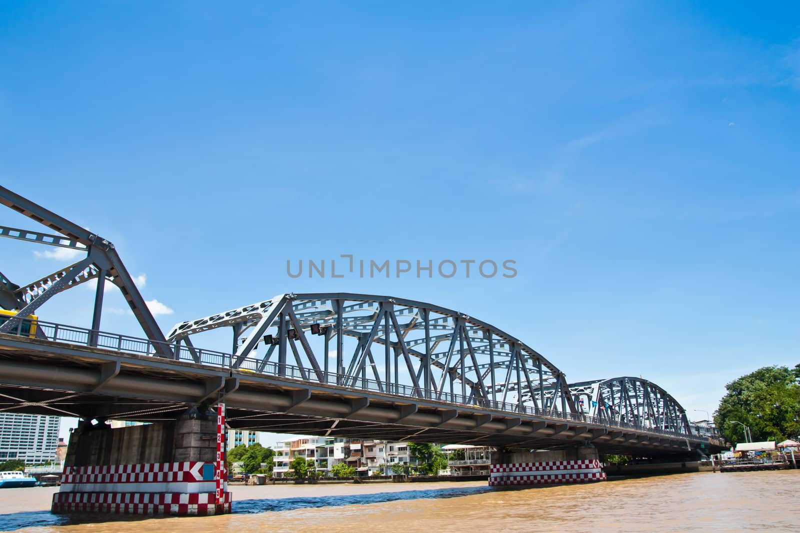 Big iron bridge against blue sky in thailand
