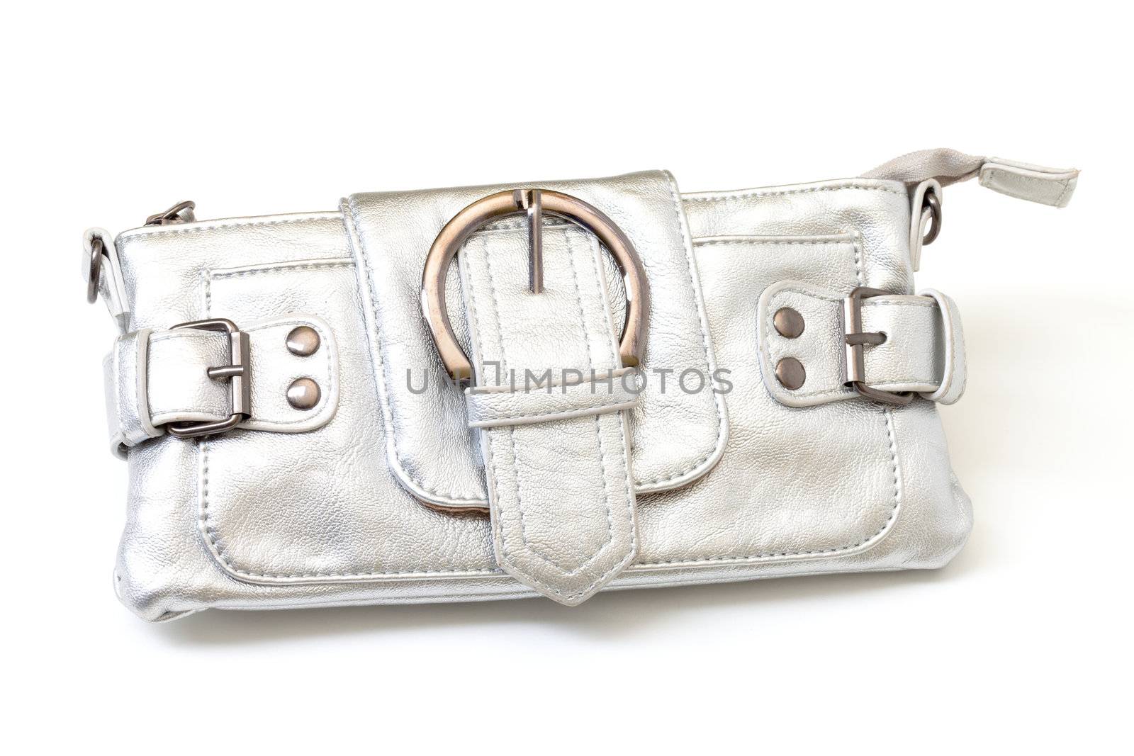 Modern luxury antique look matt silver clutch purse with large ornate buckles and a zipper isolated on white