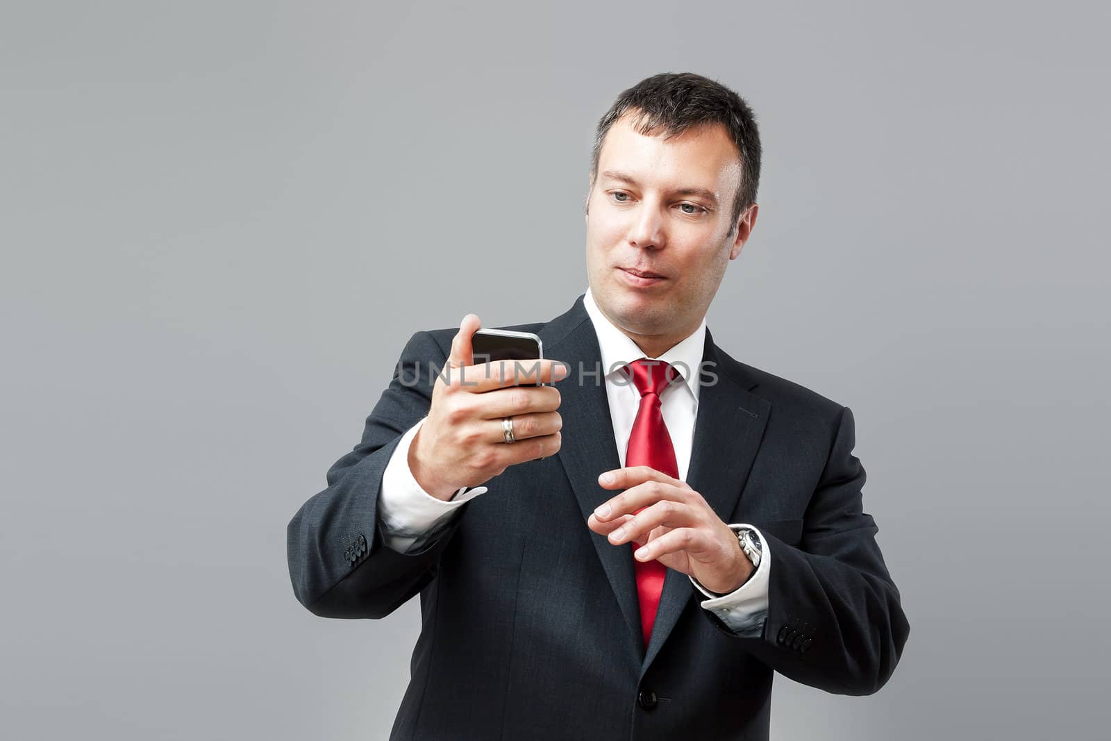 An image of a business man with his mobile phone