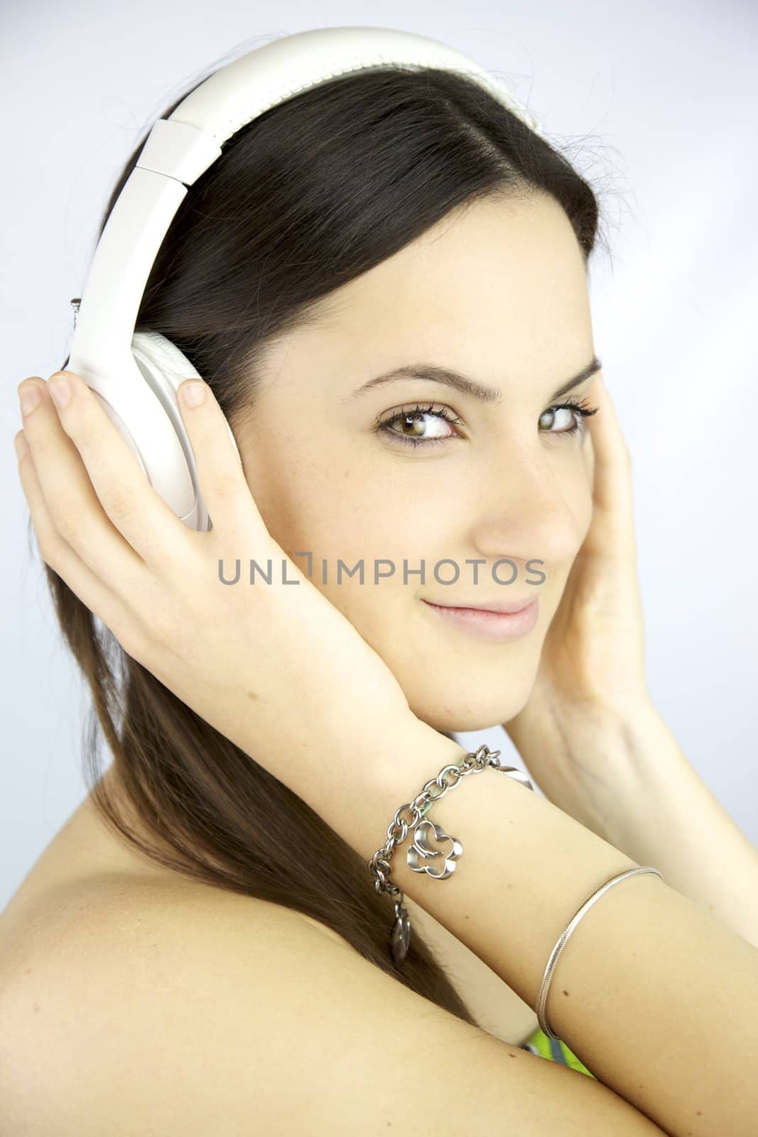 Beautiful girl smiling listening music by fmarsicano