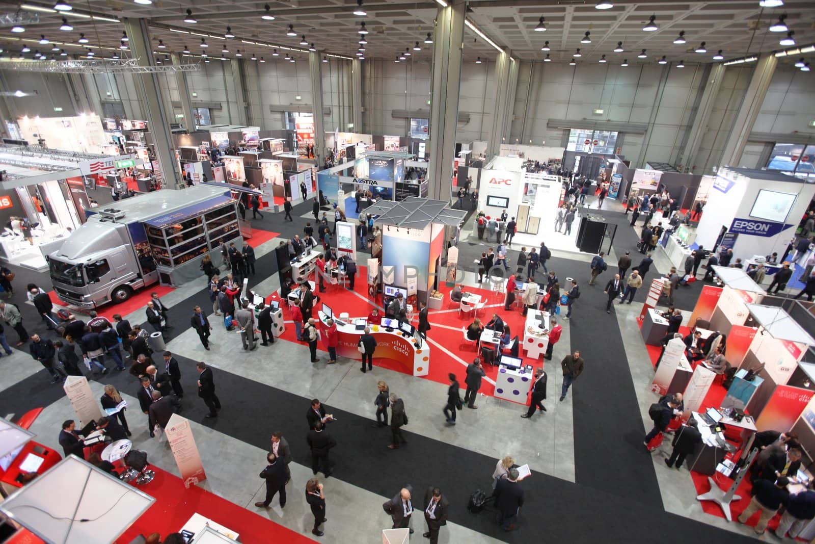 MILAN, ITALY - OCTOBER 17: People visit technologies products exhibition area at SMAU, international fair of business intelligence and information technology October 17, 2012 in Milan, Italy.