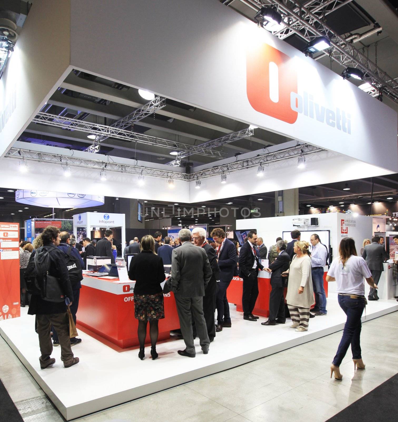 MILAN, ITALY - OCTOBER 17: People visit Olivetti technologies products exhibition area at SMAU, international fair of business intelligence and information technology October 17, 2012 in Milan, Italy.