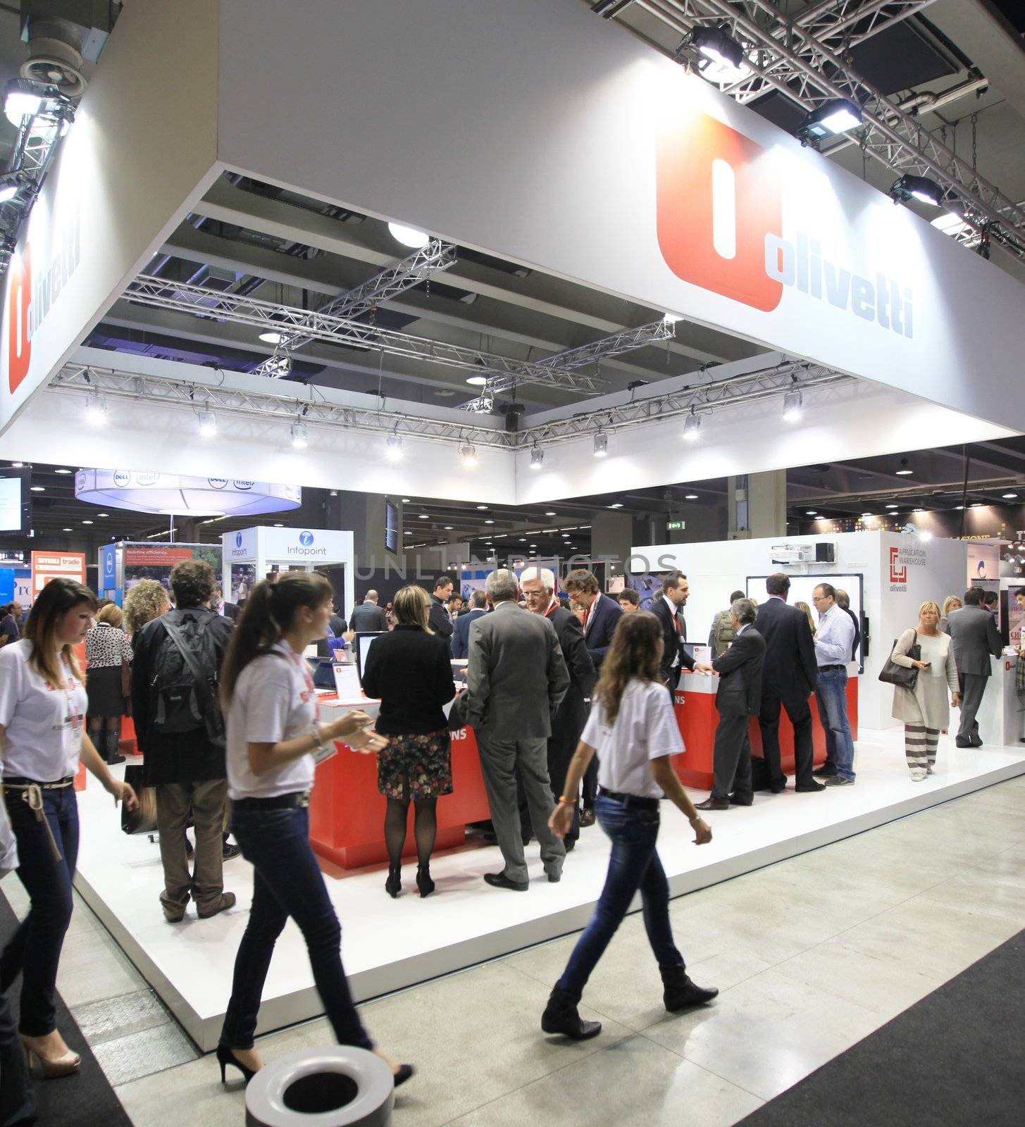 MILAN, ITALY - OCTOBER 17: People visit Olivetti technologies products exhibition area at SMAU, international fair of business intelligence and information technology October 17, 2012 in Milan, Italy.