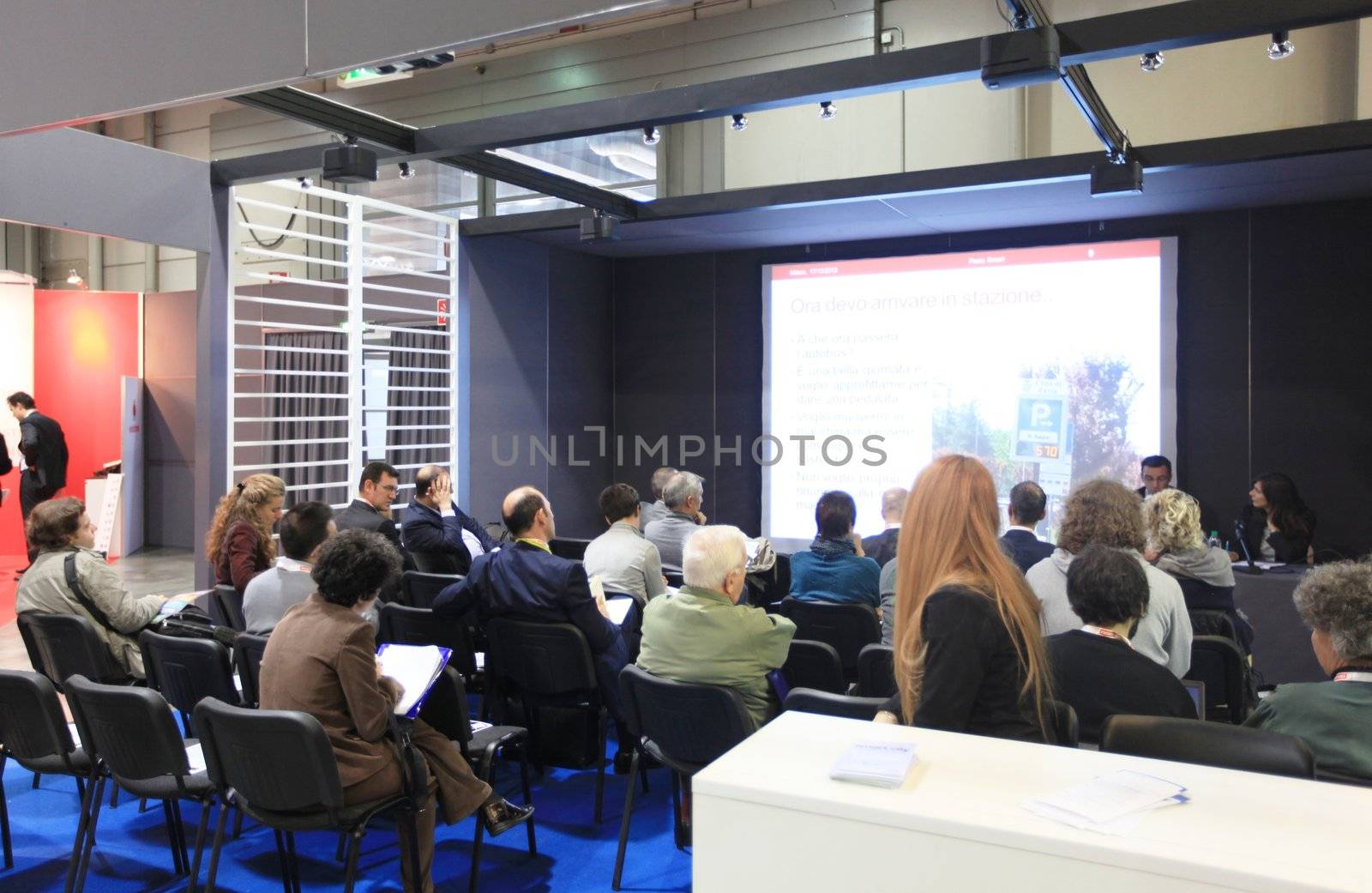 MILAN, ITALY - OCTOBER 17: People attending business meeting during SMAU, international fair of business intelligence and information technology October 17, 2012 in Milan, Italy.