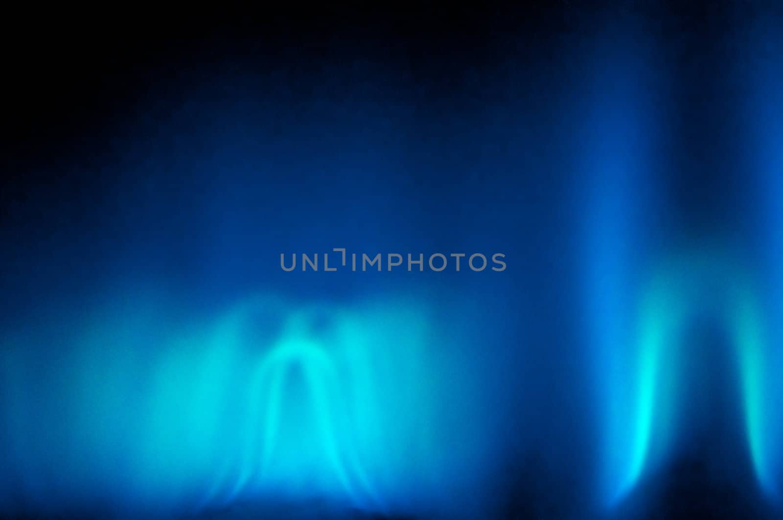 An abstract shot of the blue flame of a gas heater.