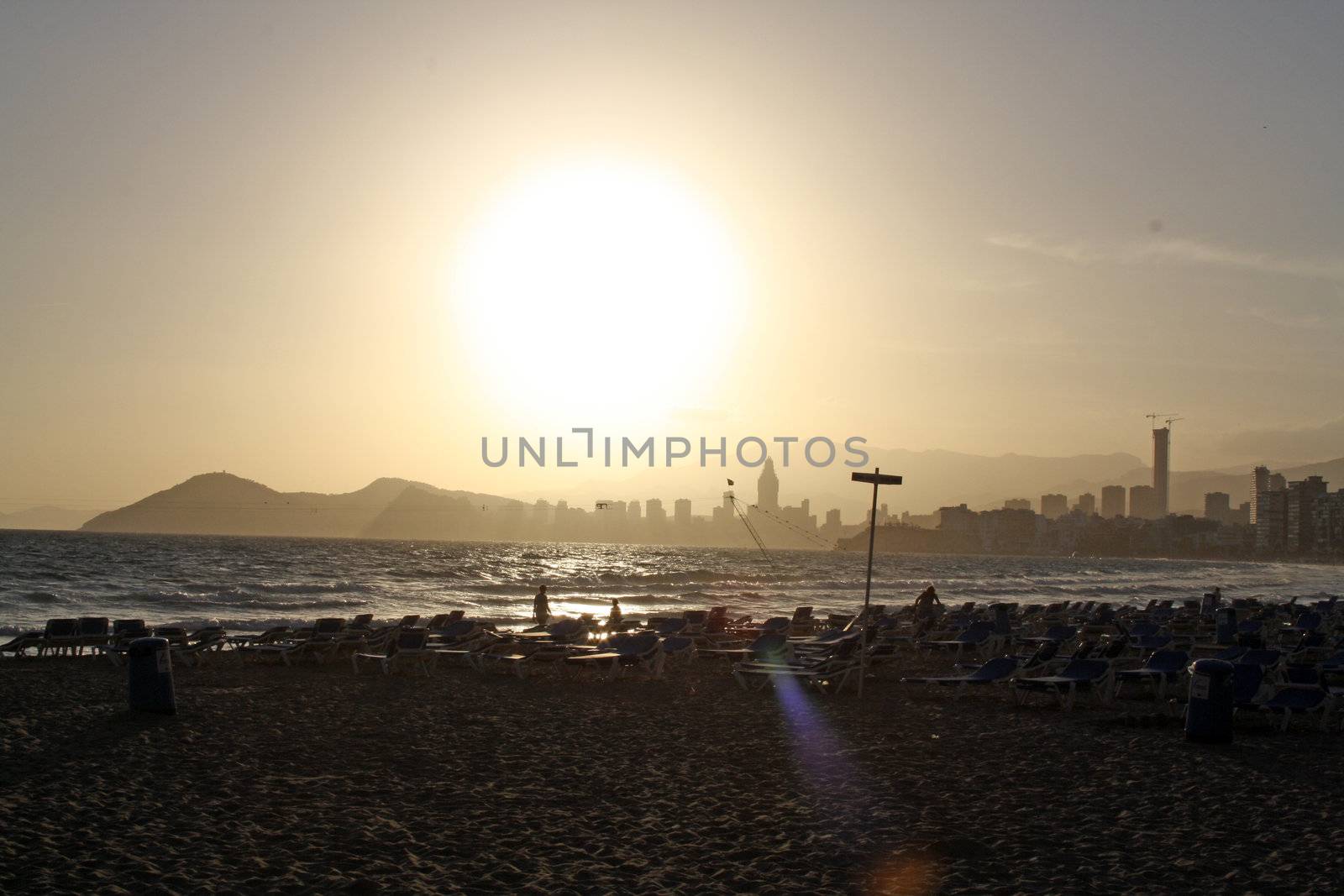 sun over the beach by lizapixels