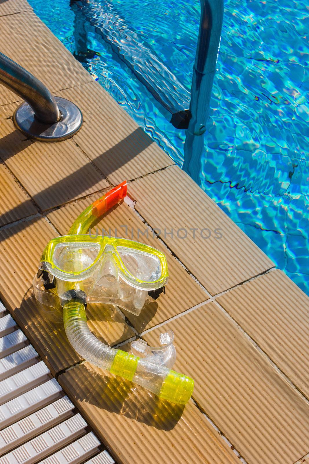 Mask and snorkel for diving near the pool by oleg_zhukov