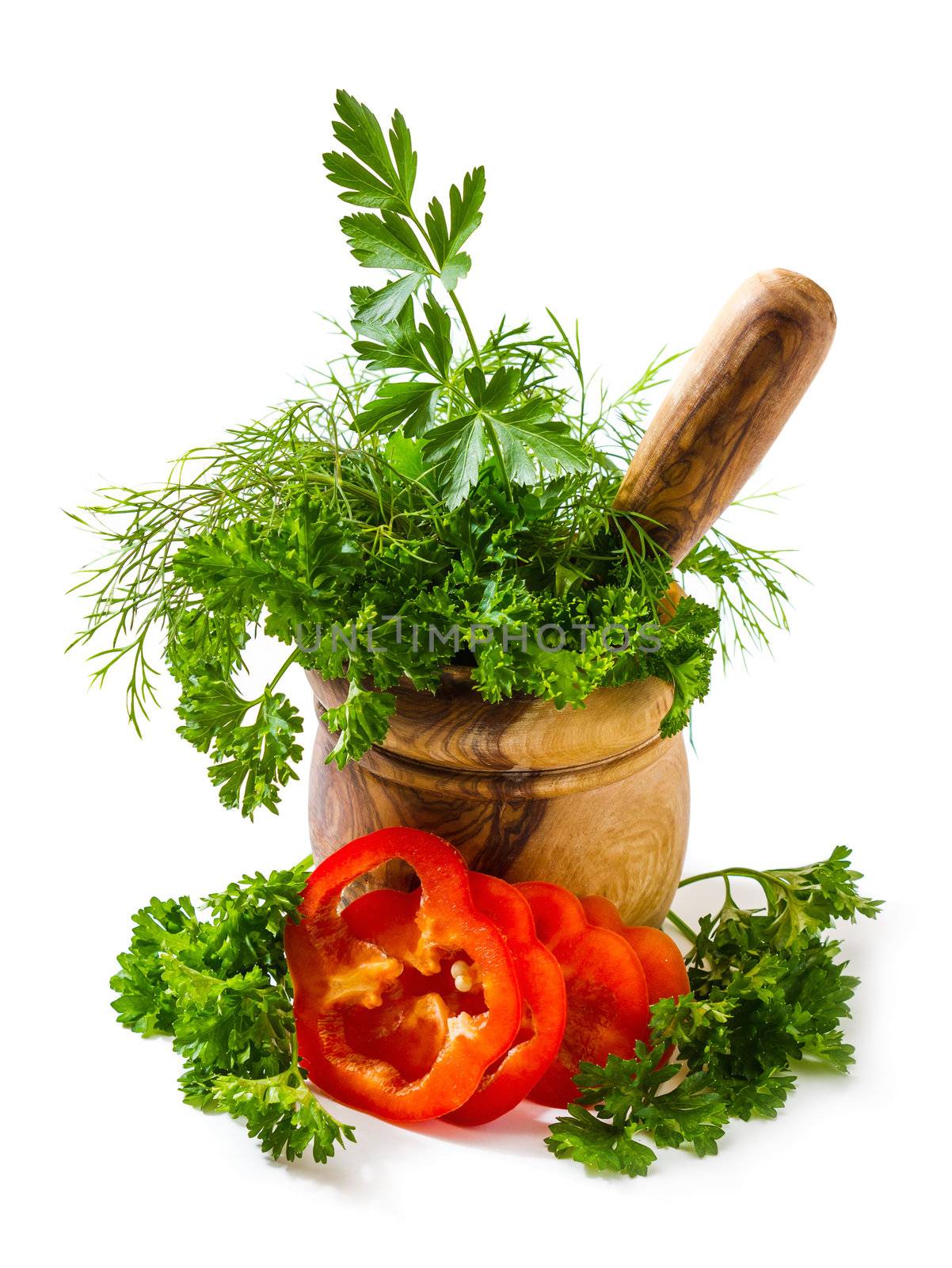 Spices and herbs in a mortar isolated on white background