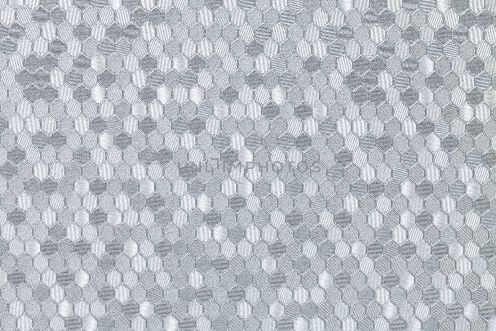 Abstract background of textured silver leather with a hexagon pattern