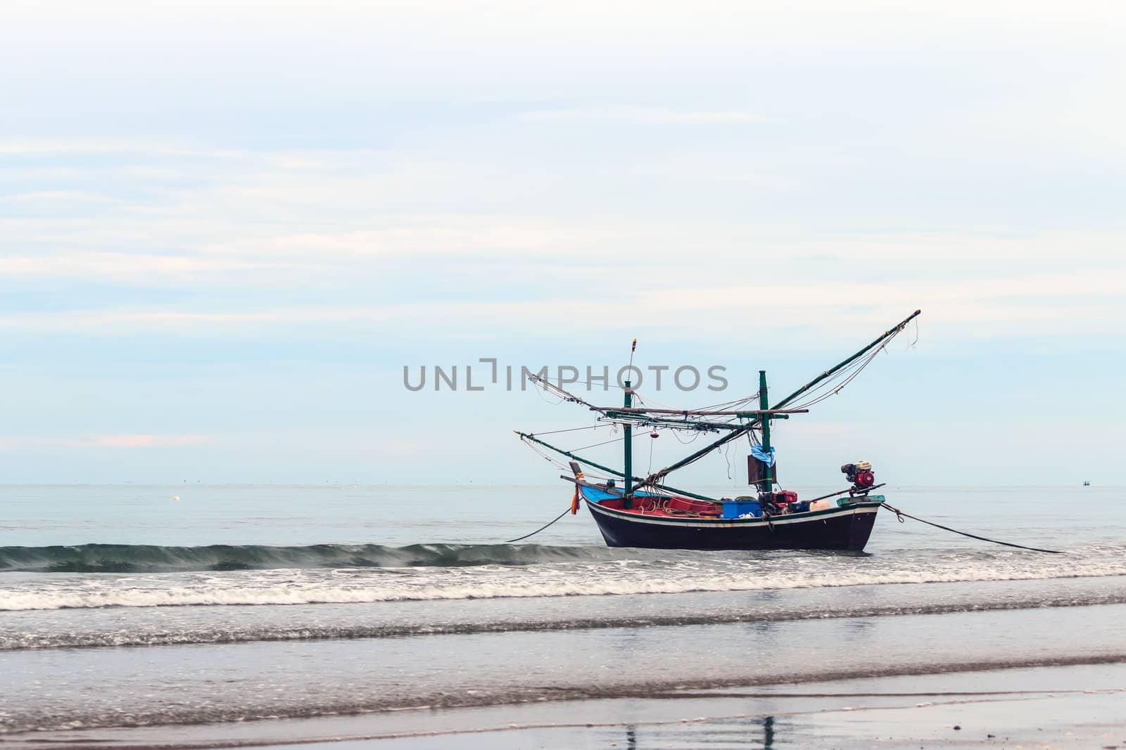 Fishing boat floating on the shore.