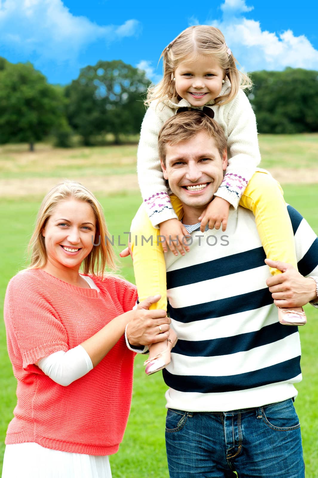 Family enjoying summer day during vacations by stockyimages