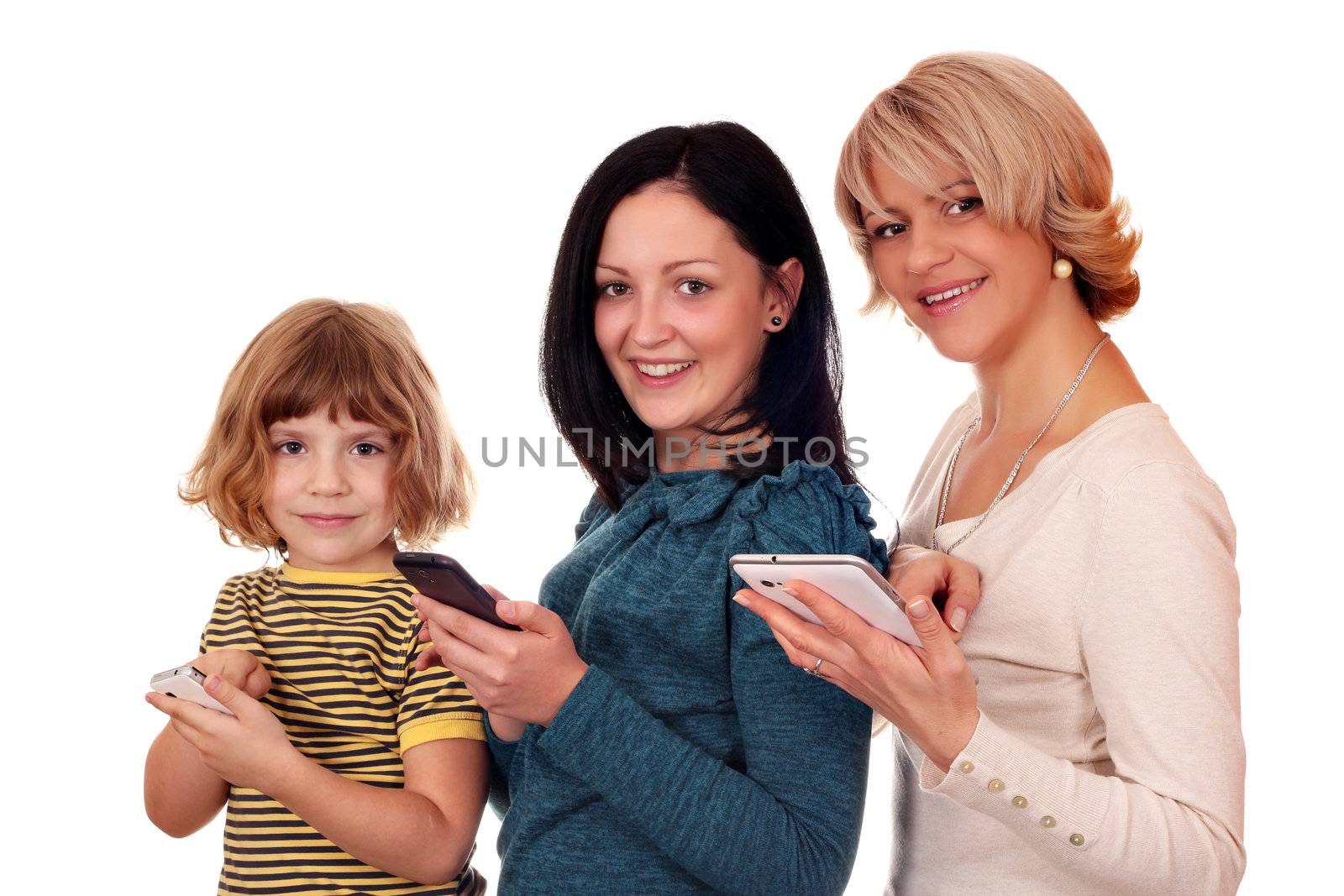 little girl  teenage girl and woman with phones and tablet pc