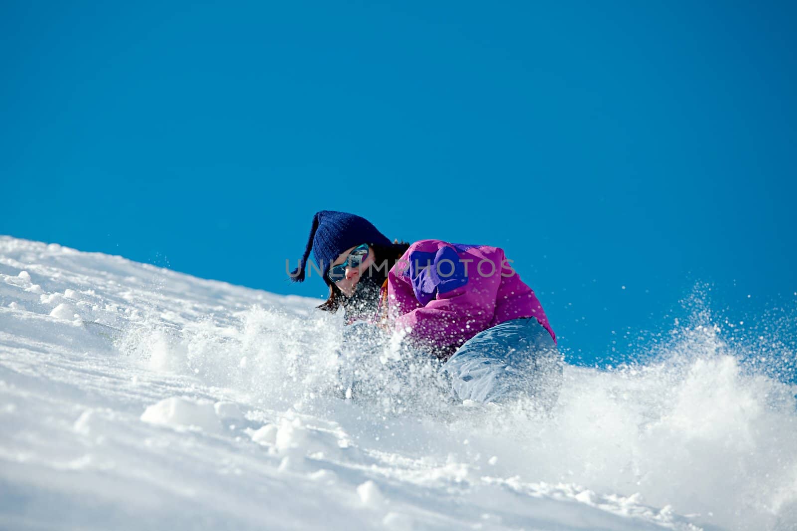 Skier coming down a steep slope