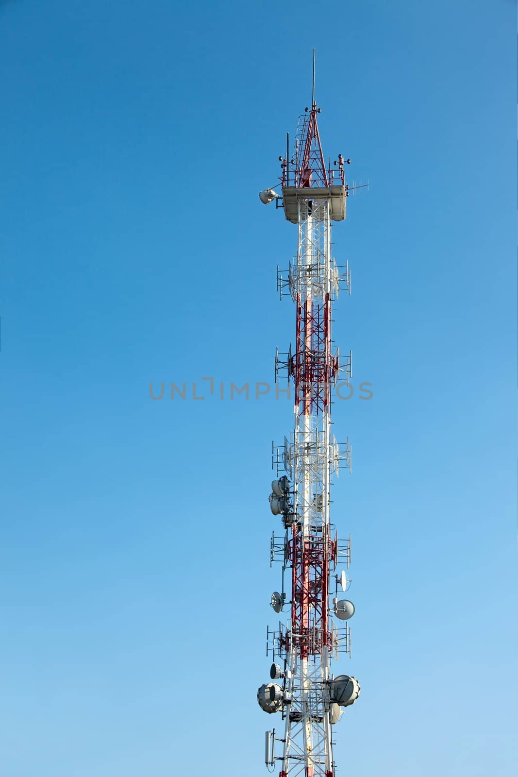 Transmitter tower against clear blue sky