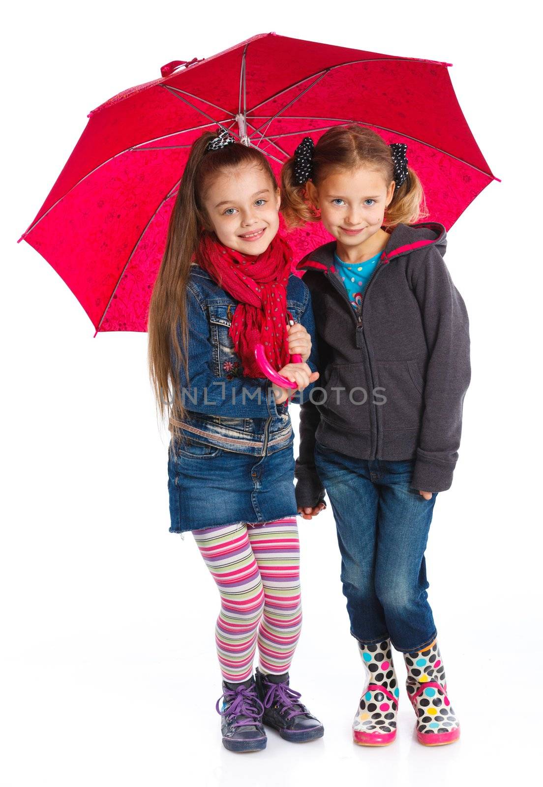 Two beautiful girls with umbrella. Isolated on white background