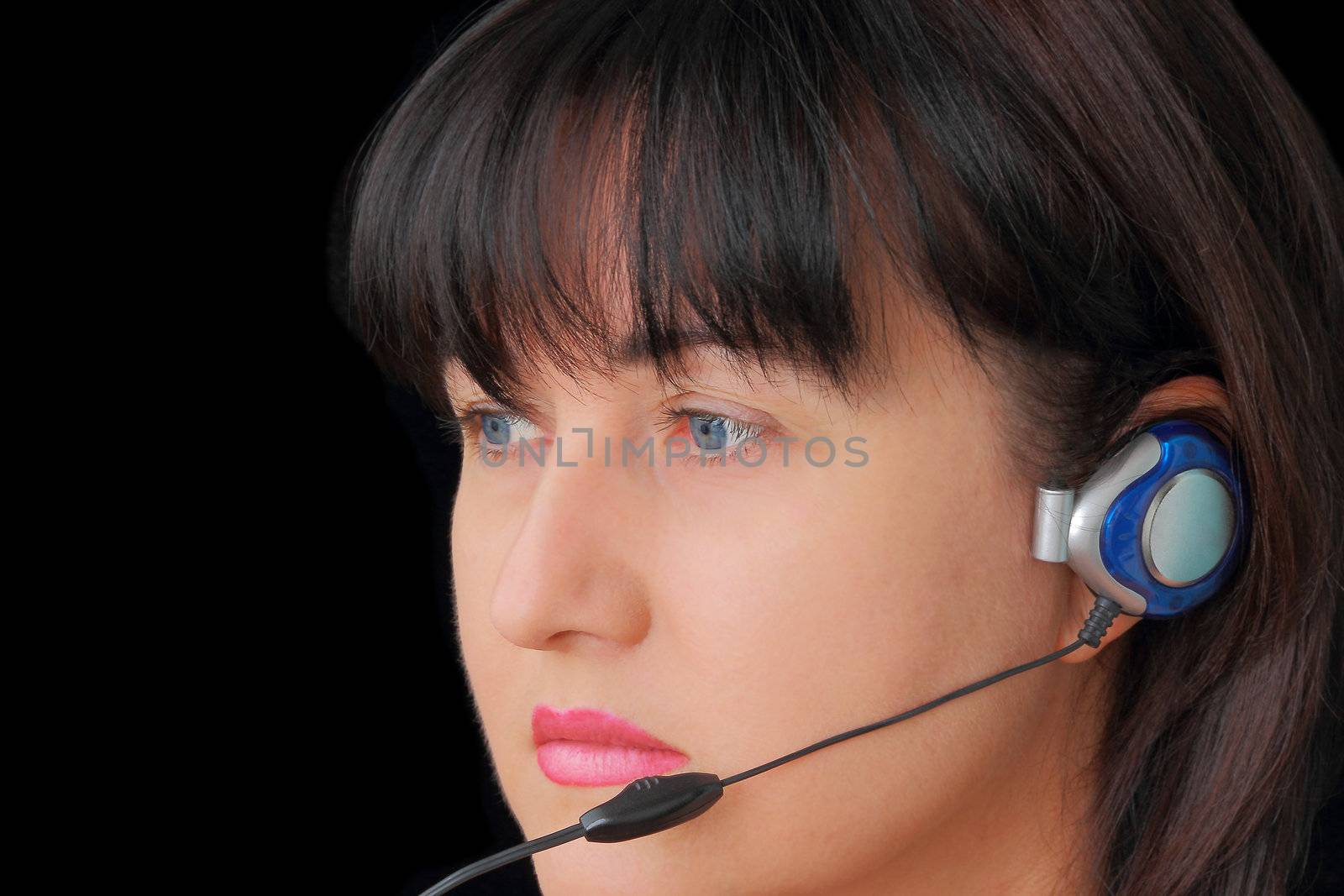 Portrait of young woman in earphone with blue eyes