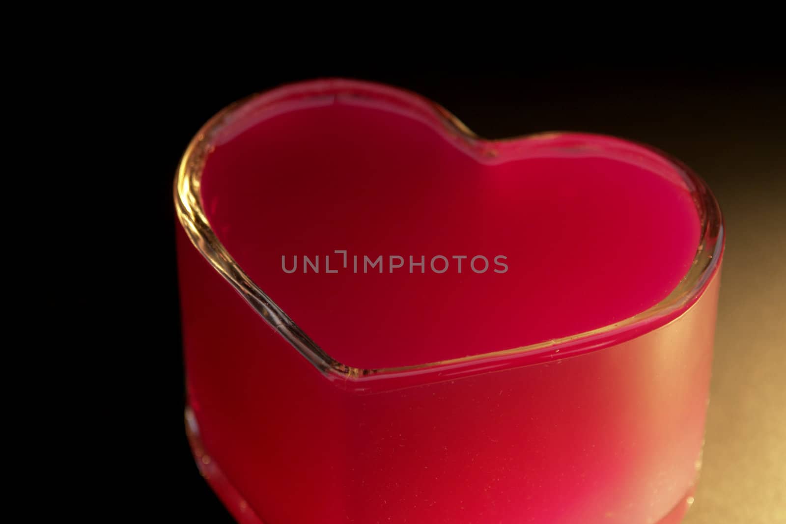 red heart made of glass. vertical image