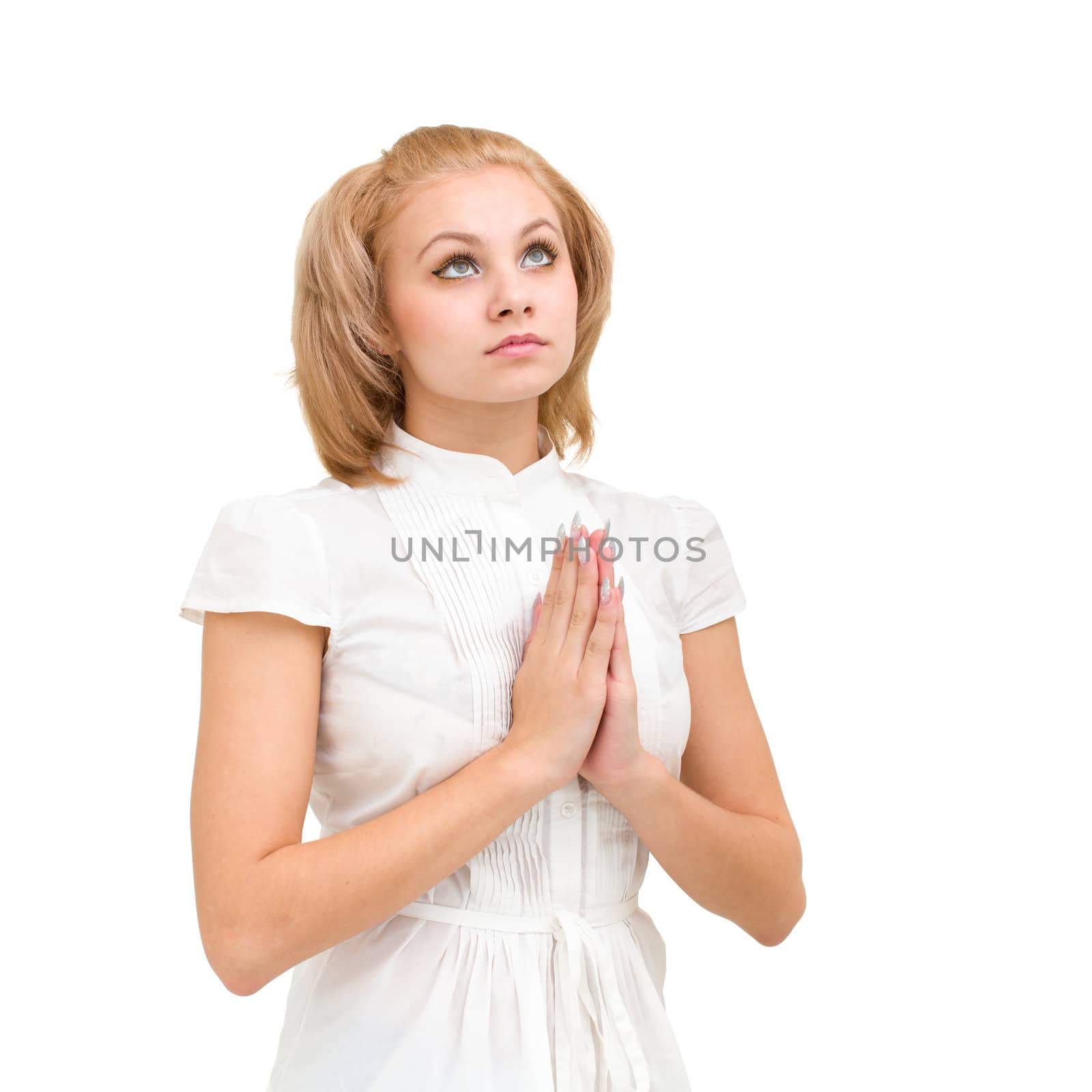 modest young woman praying, isolated on white background