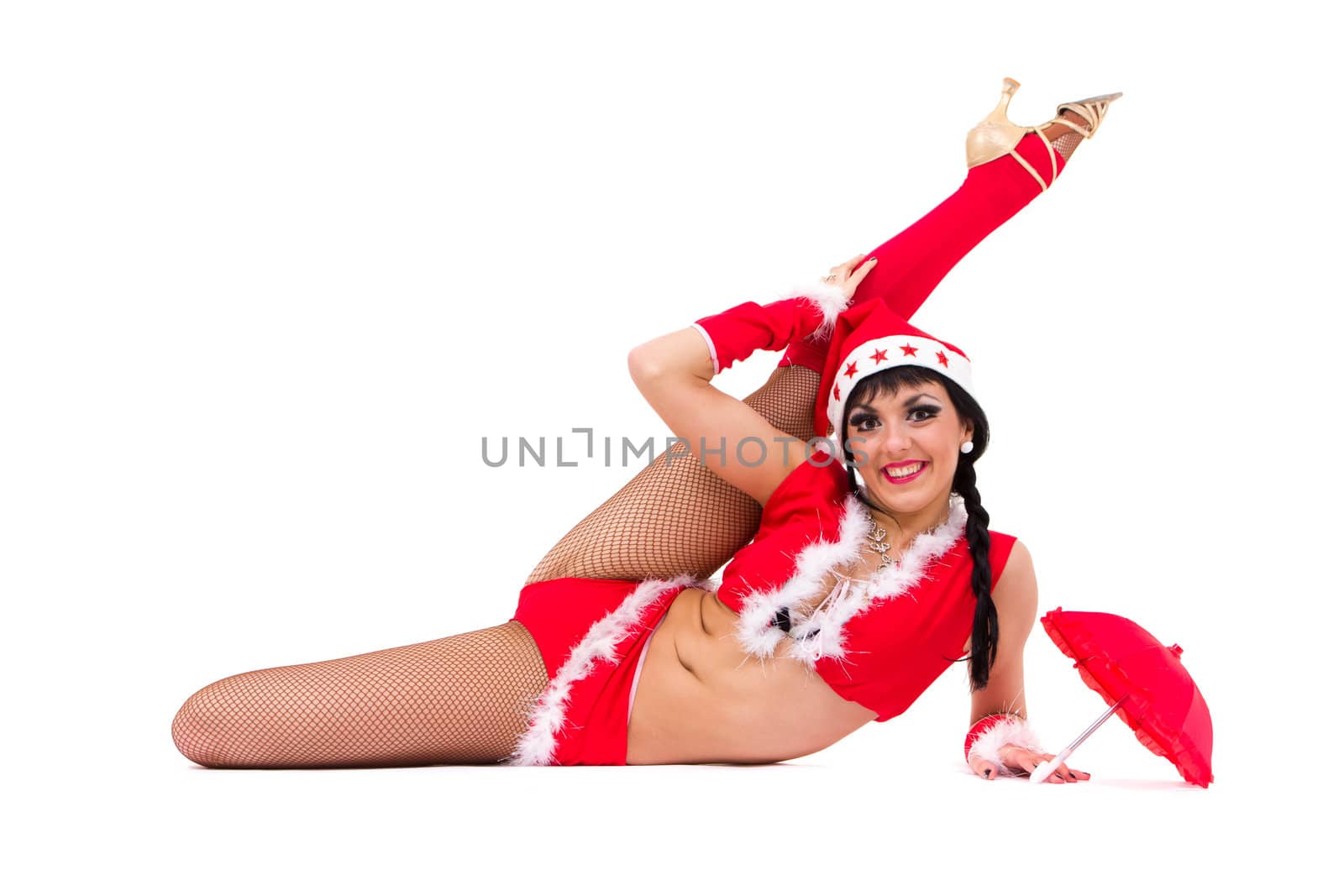 beautiful sexy girl wearing santa claus clothes posing against isolated white background