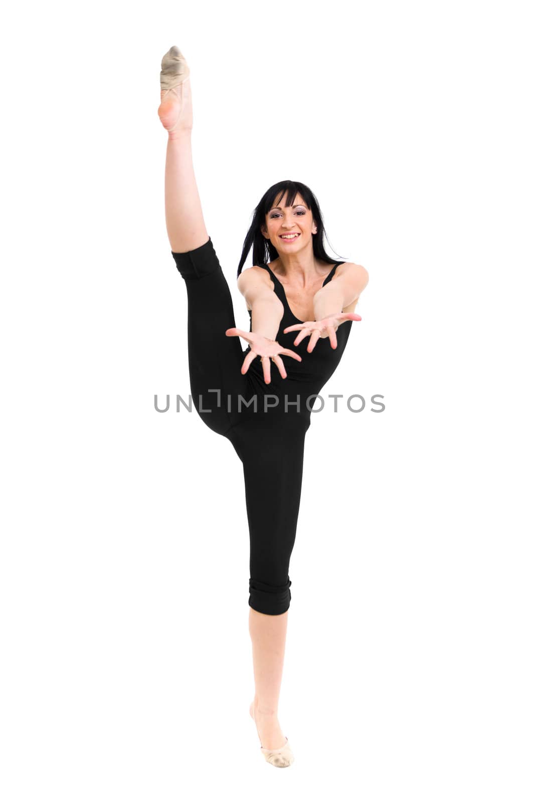 dancer makes split against isolated white background