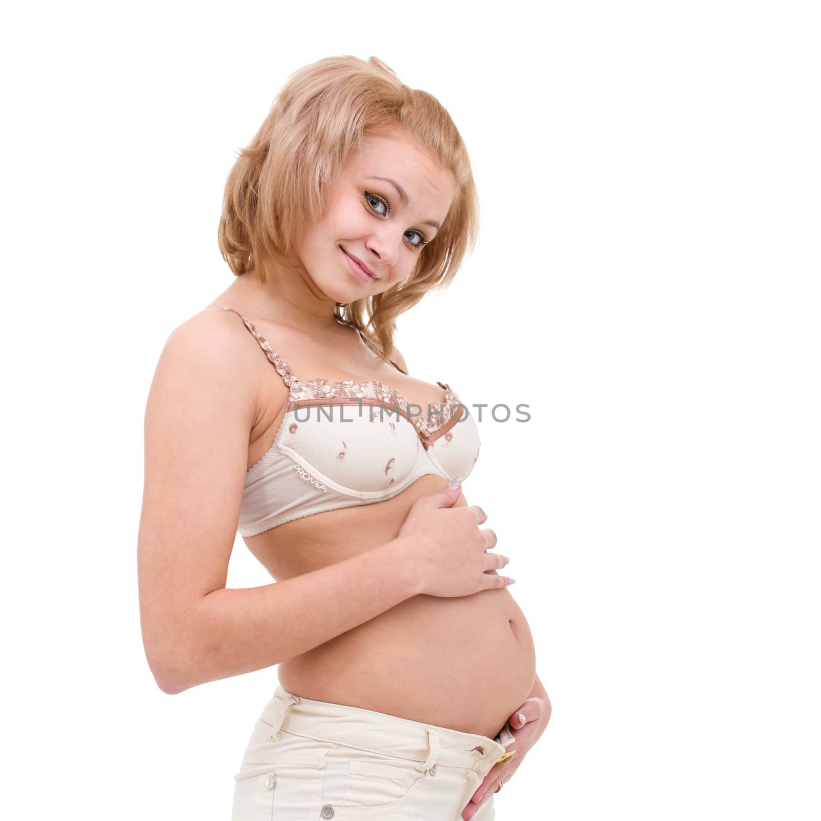 pregnant young woman posing against isolated white background