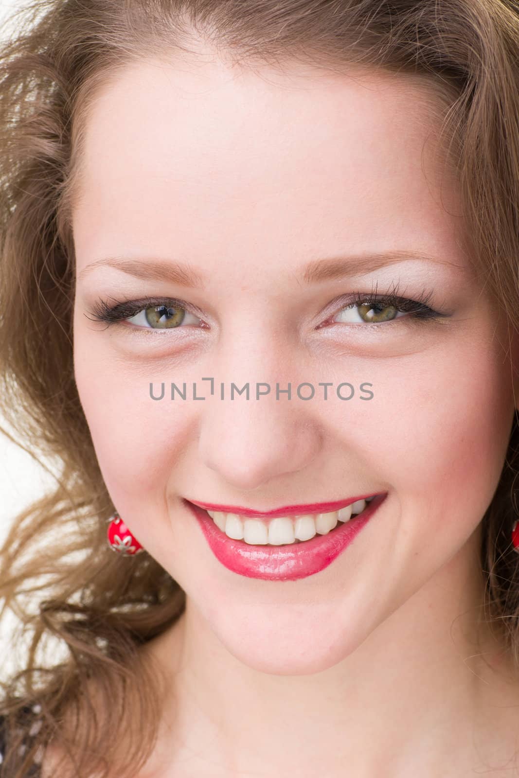 friendly smiling young woman portrait closeup studio shot