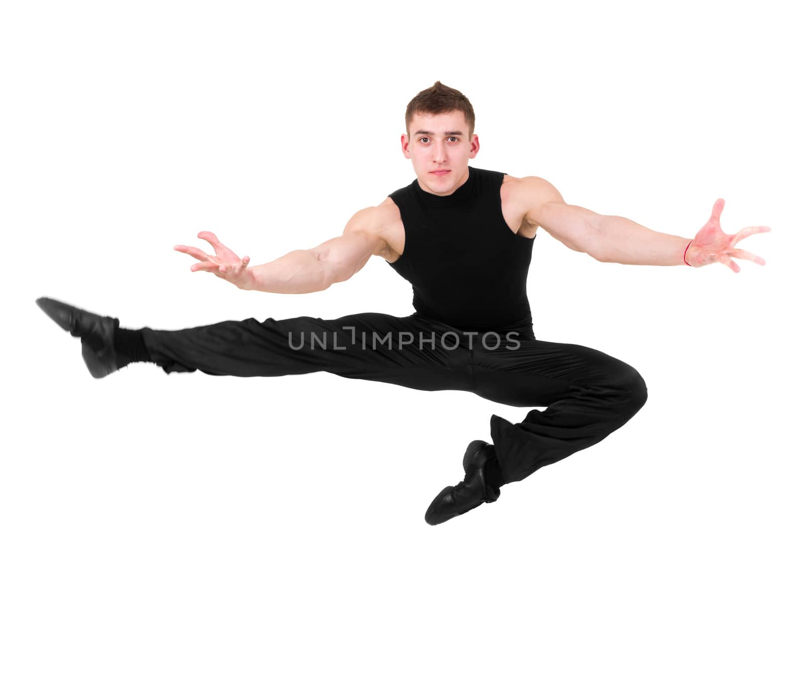 Young man jumping against isolated white background