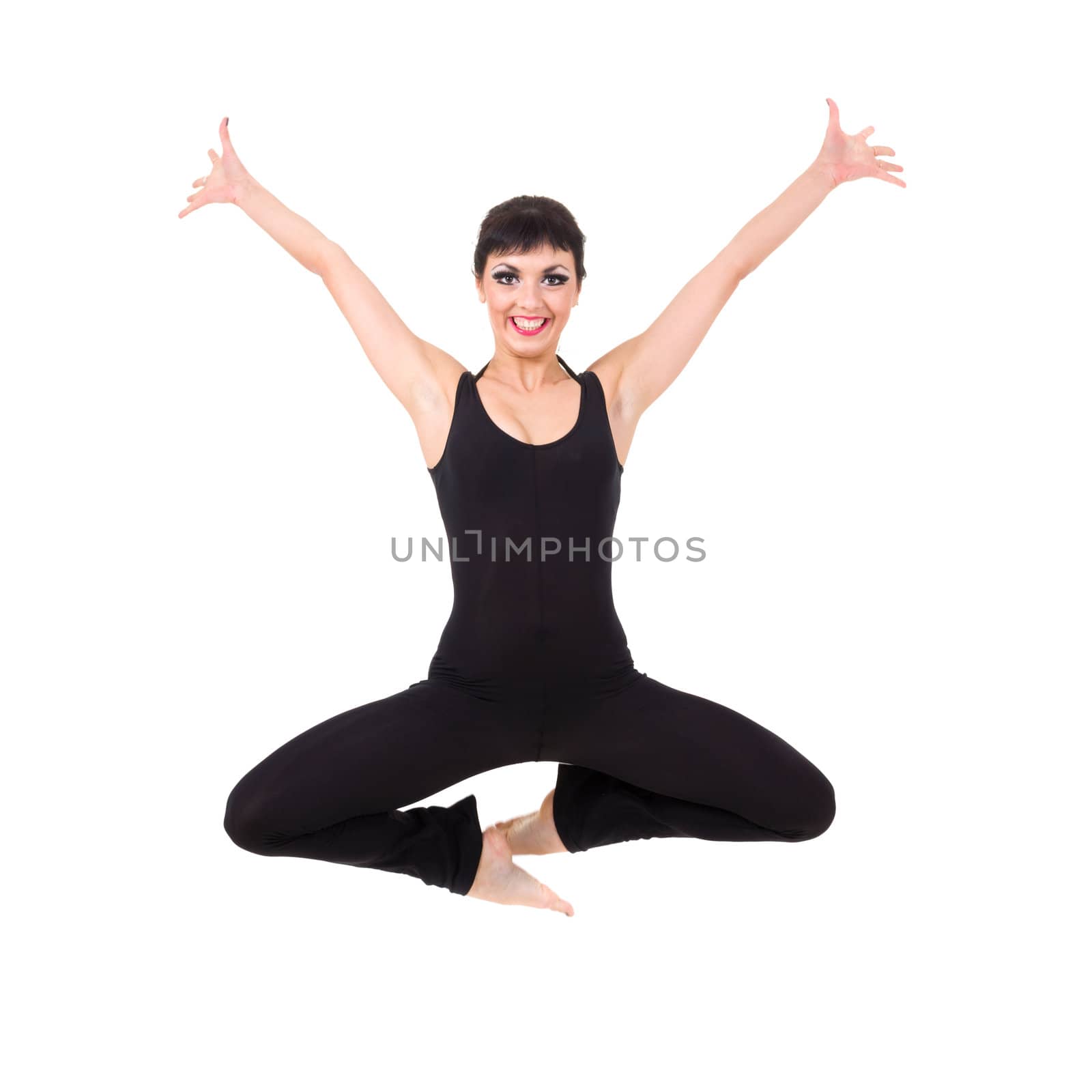 Attractive young dancer jumping against isolated white background
