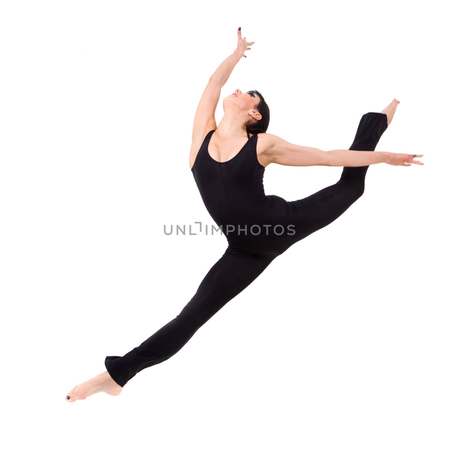 Young woman makes splits, jumping against isolated white background