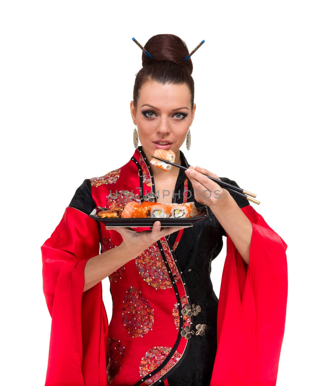 Attractive woman in traditional dress with sushi, isolated on white background.