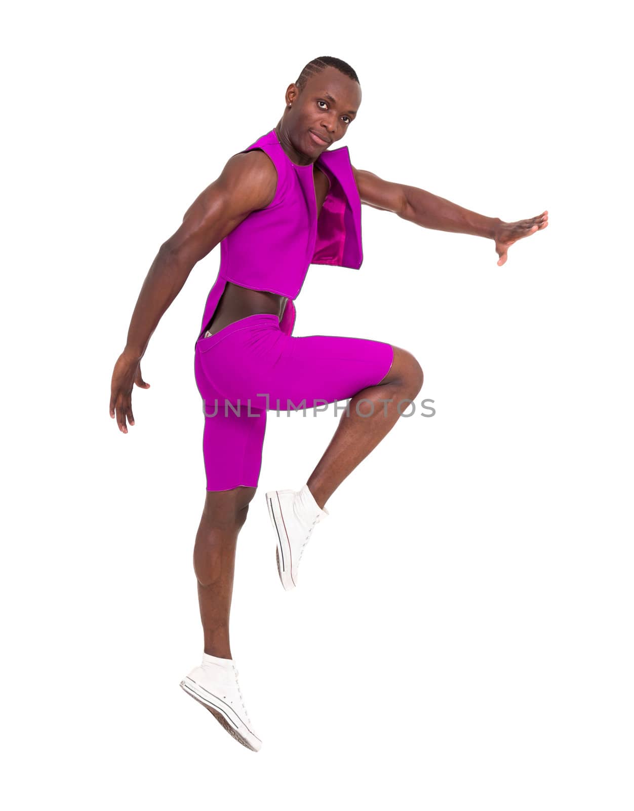 Young man jumping against isolated white background