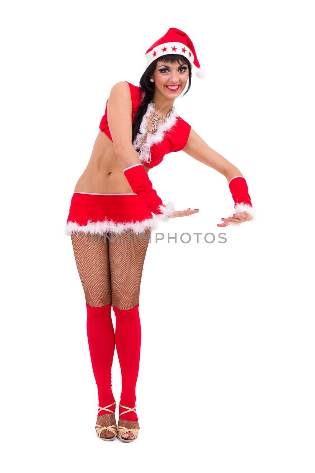 Young woman wearing santa claus clothes posing against isolated white background