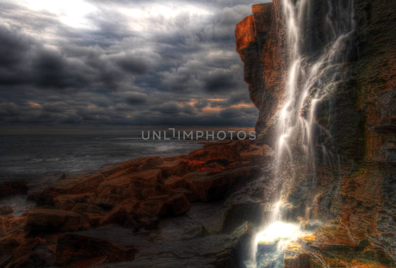 Waterfall landscape and seascape in high dynamic range on the southern British coast