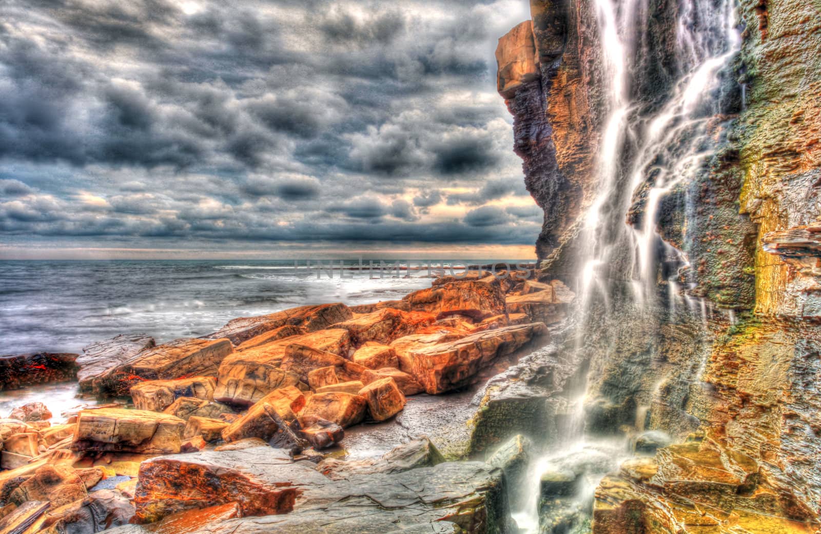 Waterfall landscape and seascape in high dynamic range on the southern British coast
