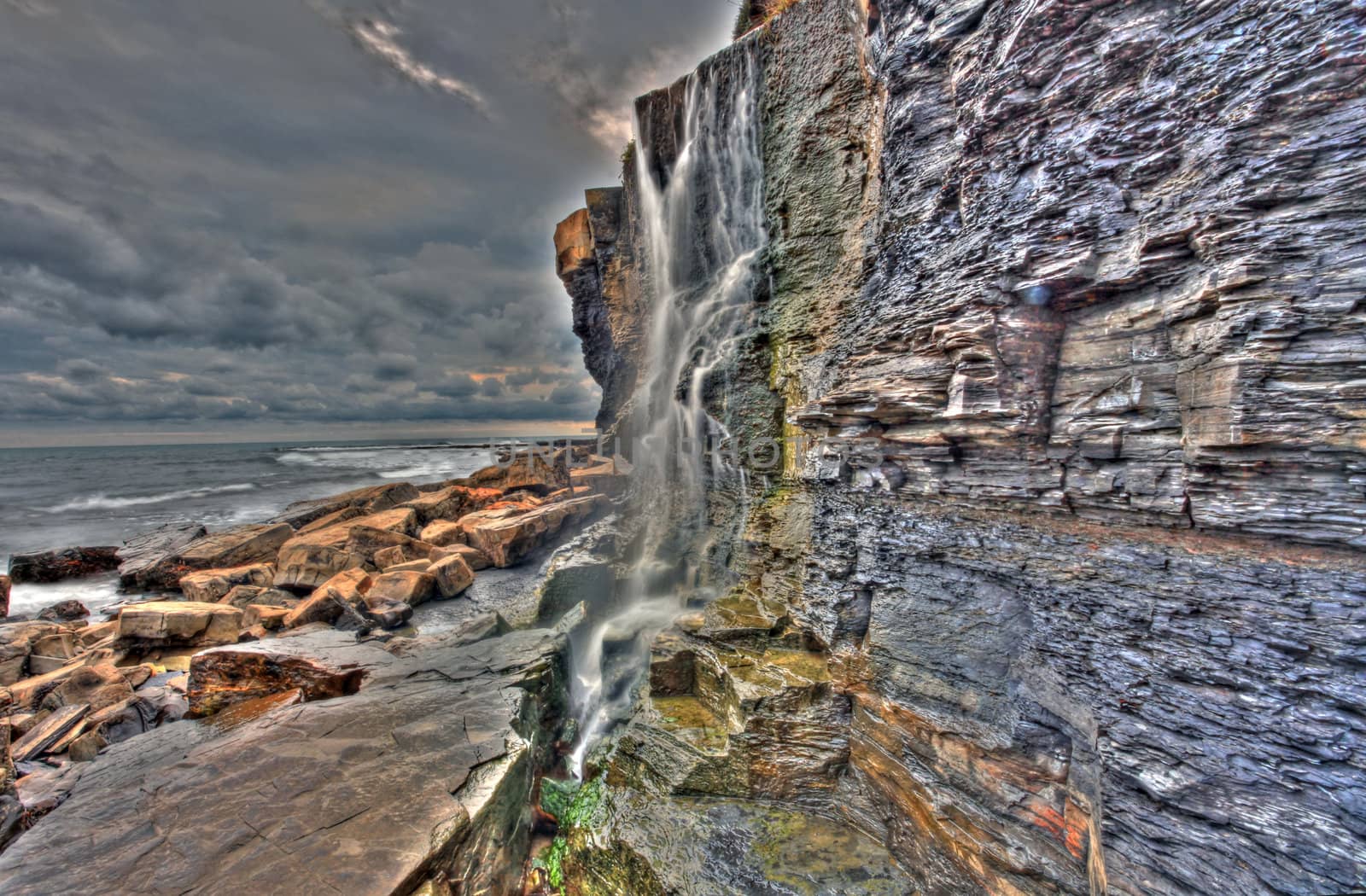 Waterfall landscape and seascape in high dynamic range on the southern British coast