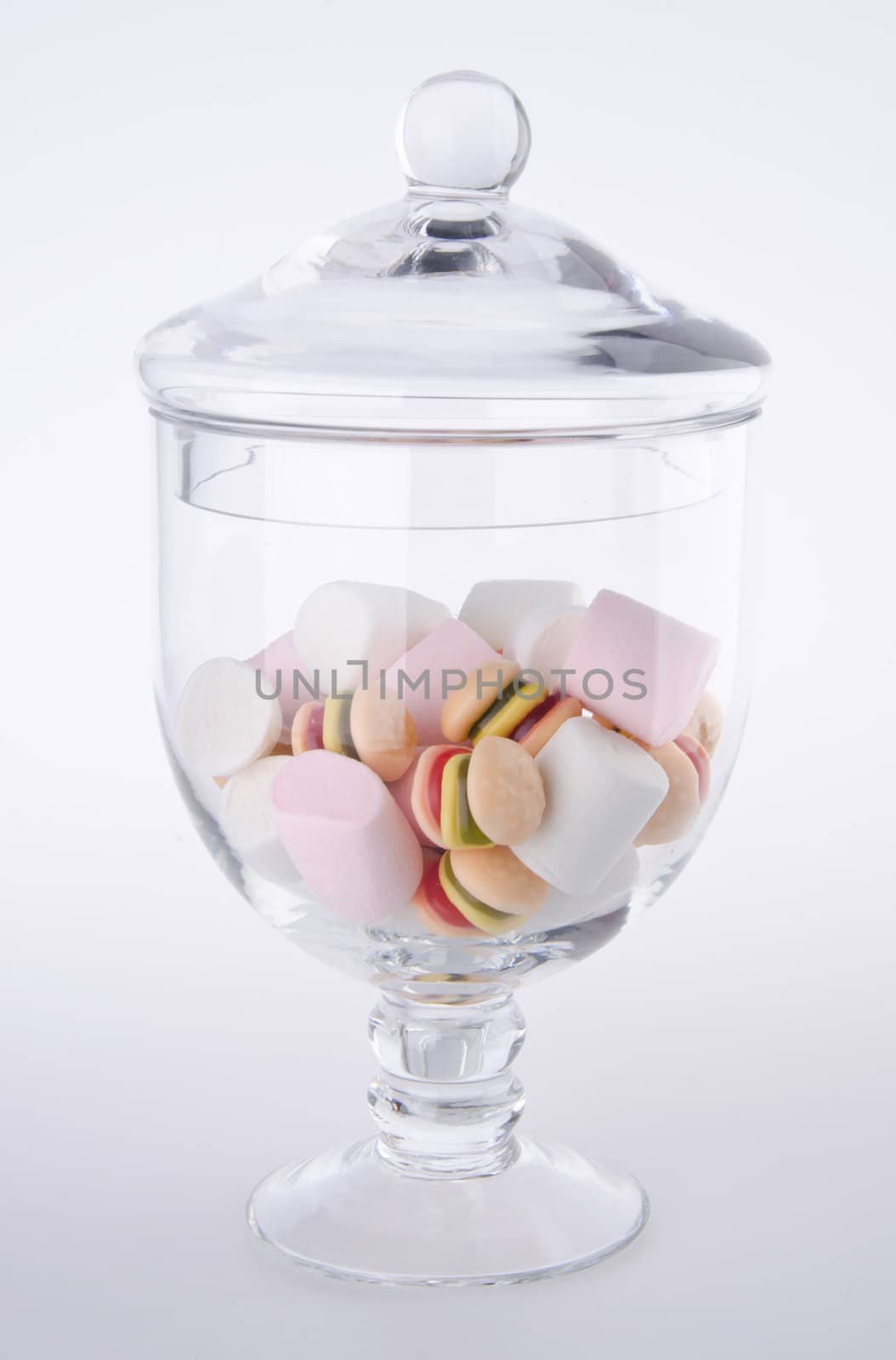 Candies. colorful candies in glass jar on the background