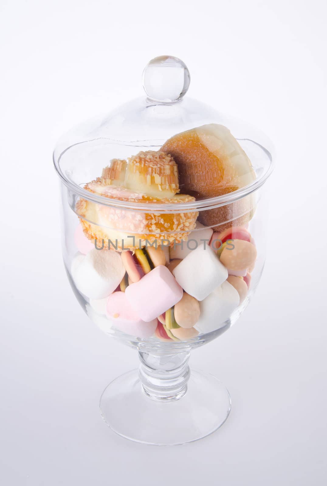 Candies. colorful candies in glass jar on the background