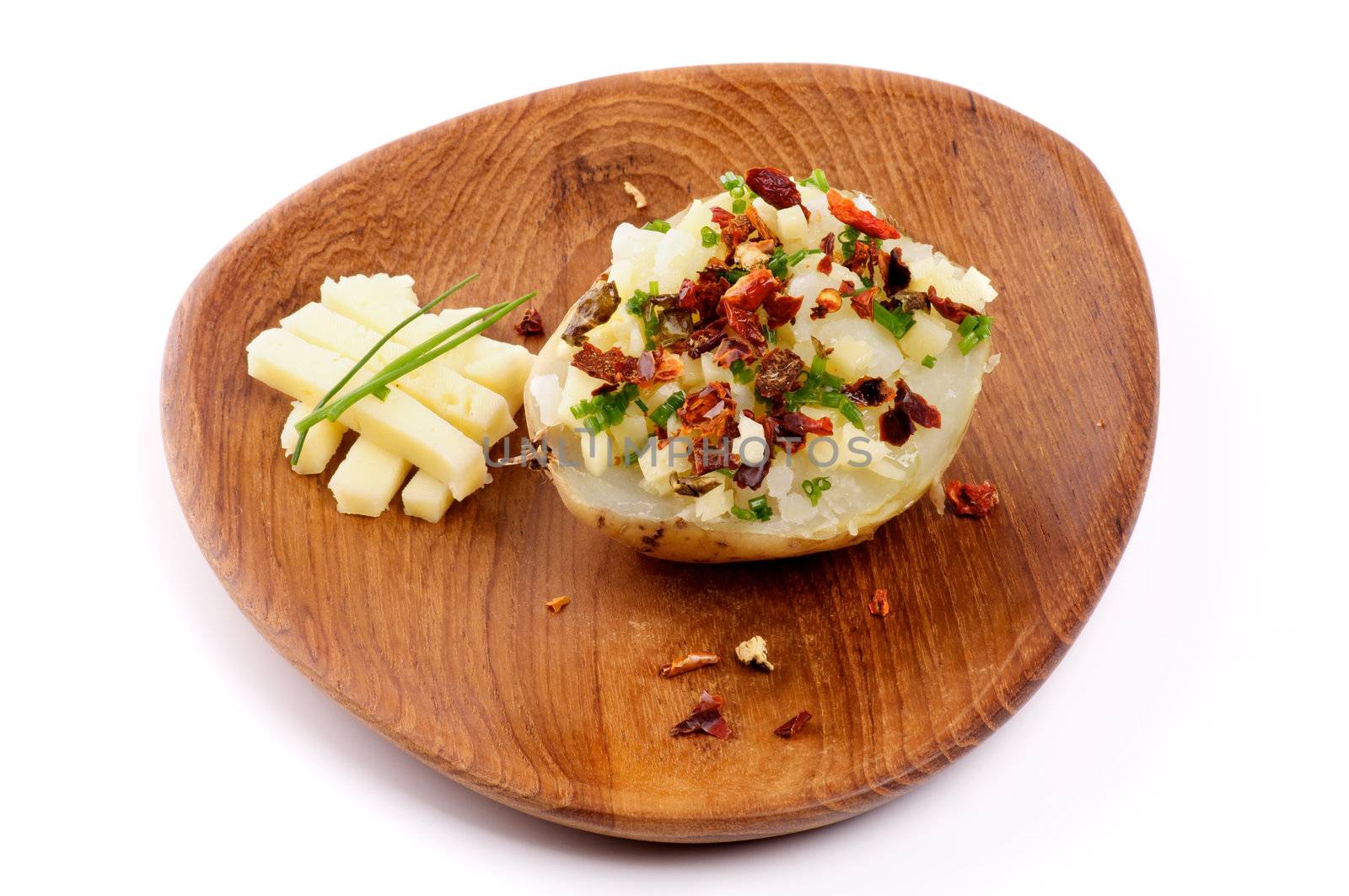Baked Potato with Cheese, Paprika and Spring Onion on Wooden plate isolated on white background