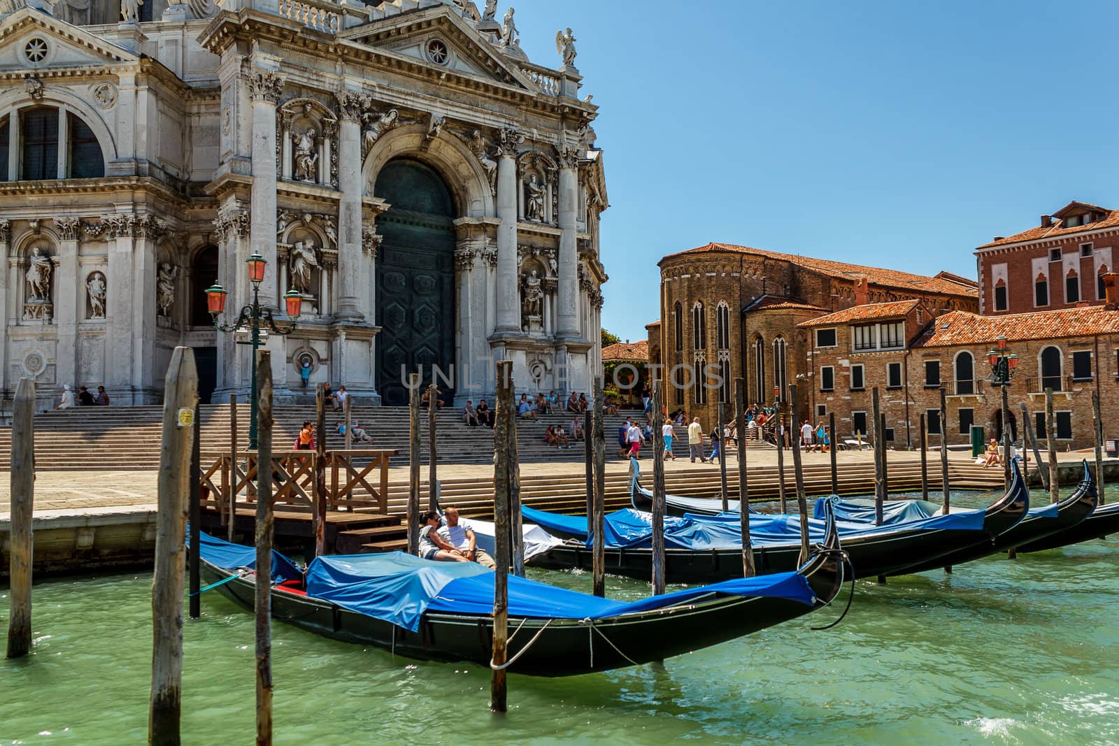 16. Jul 2012 - Gondolas and tourists at canal in Venice, Italy
