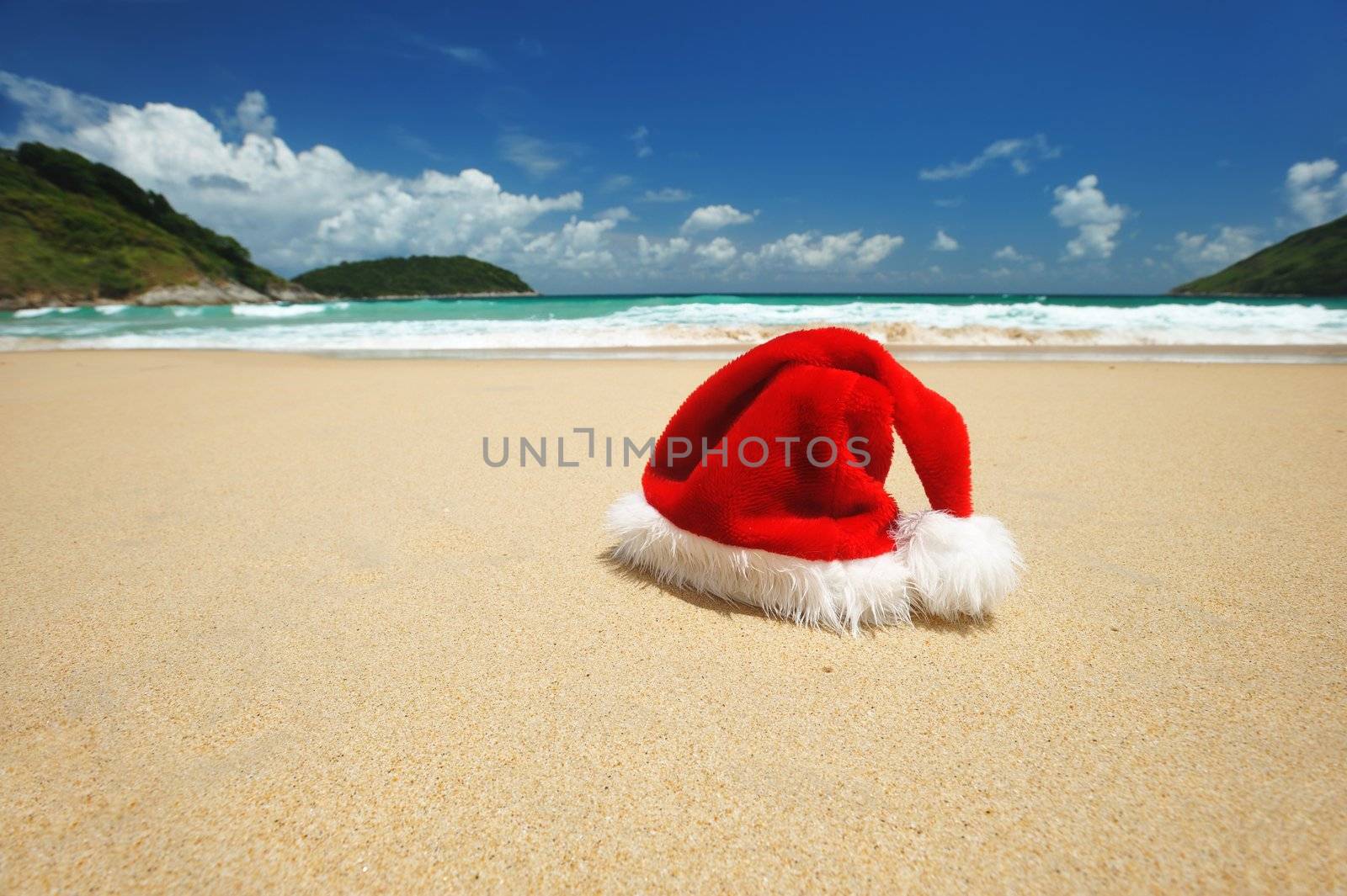 Santa's hat on a tropical beach