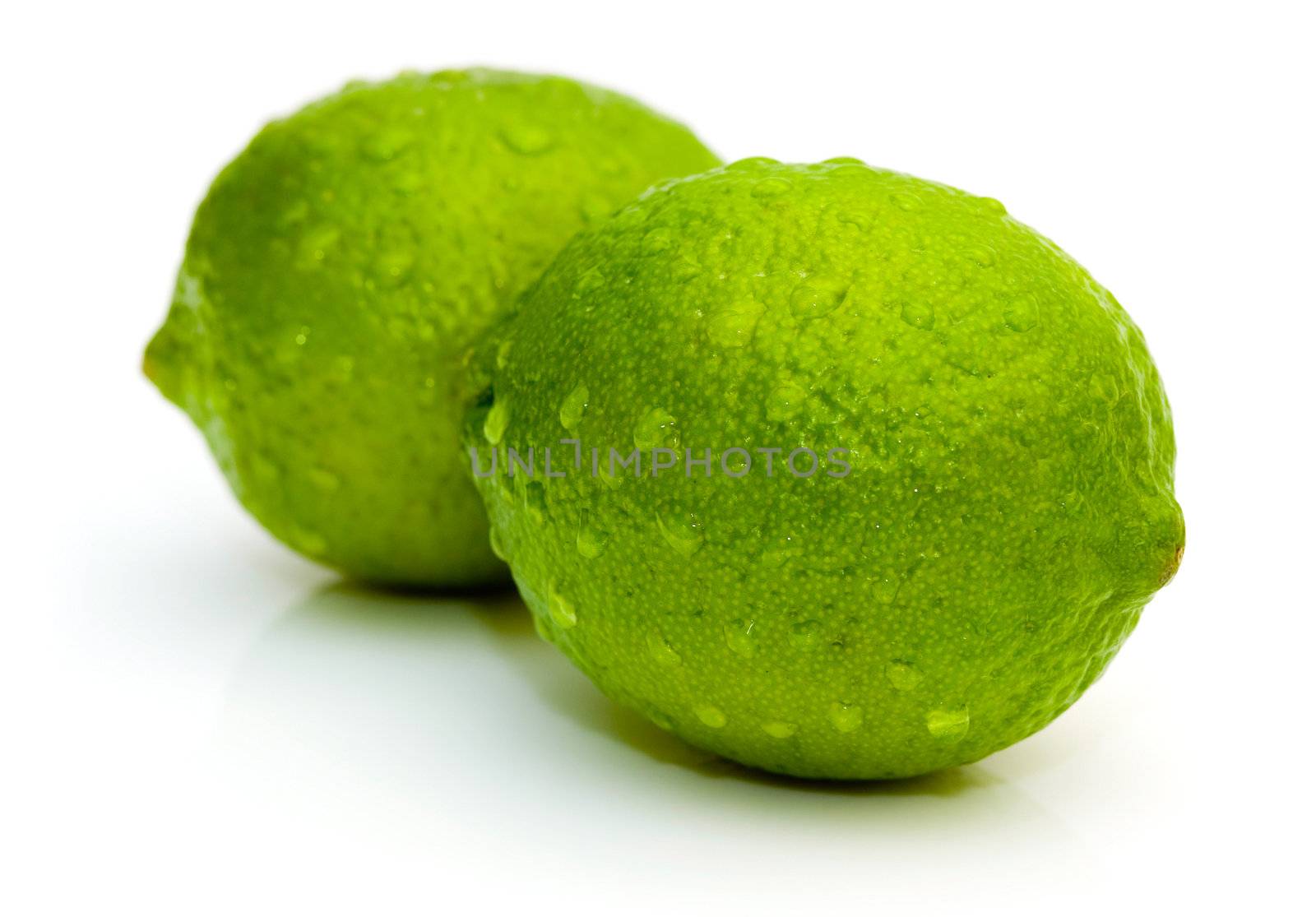 Lime with water drops isolated on white background