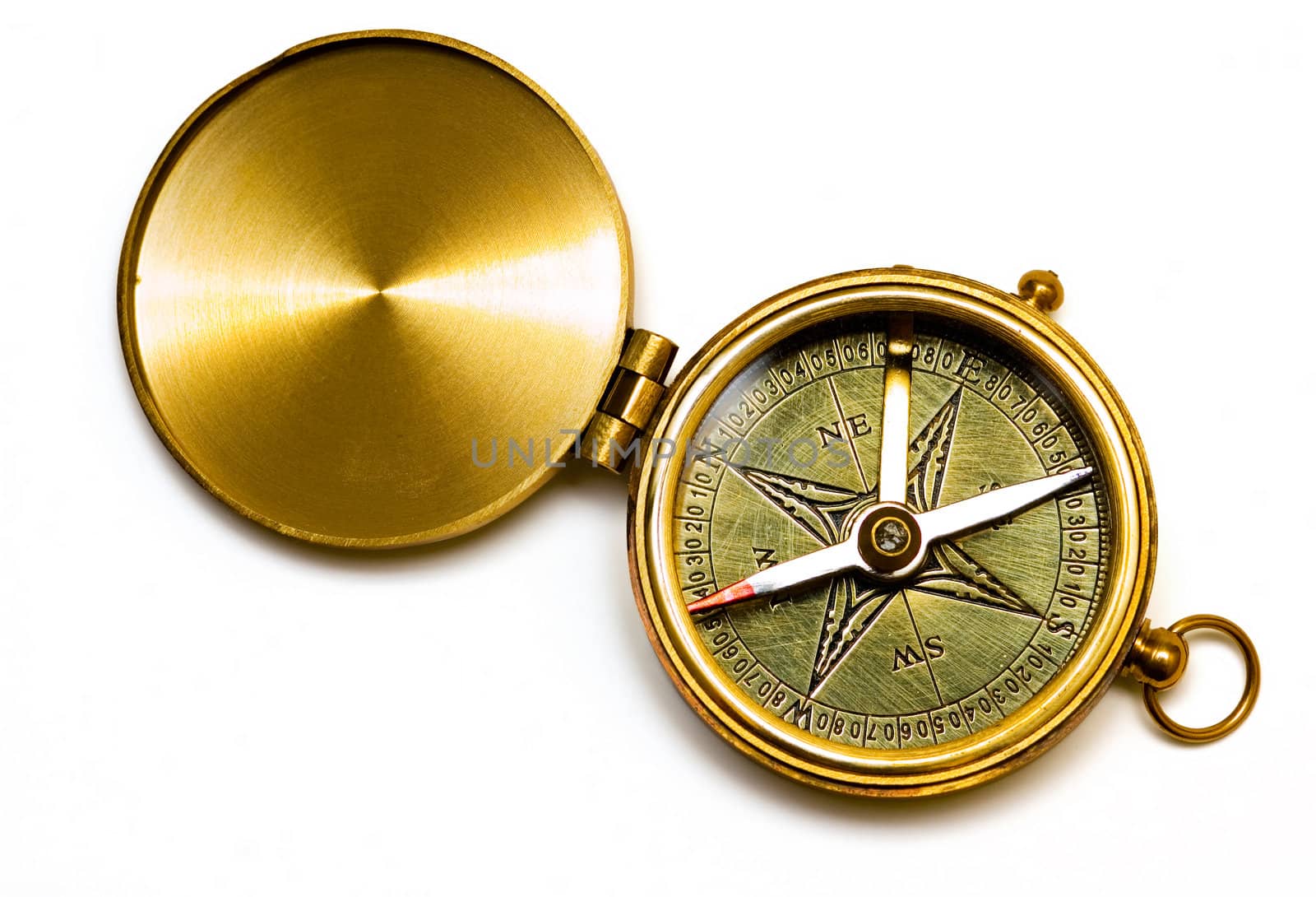 Old style brass compass on white background