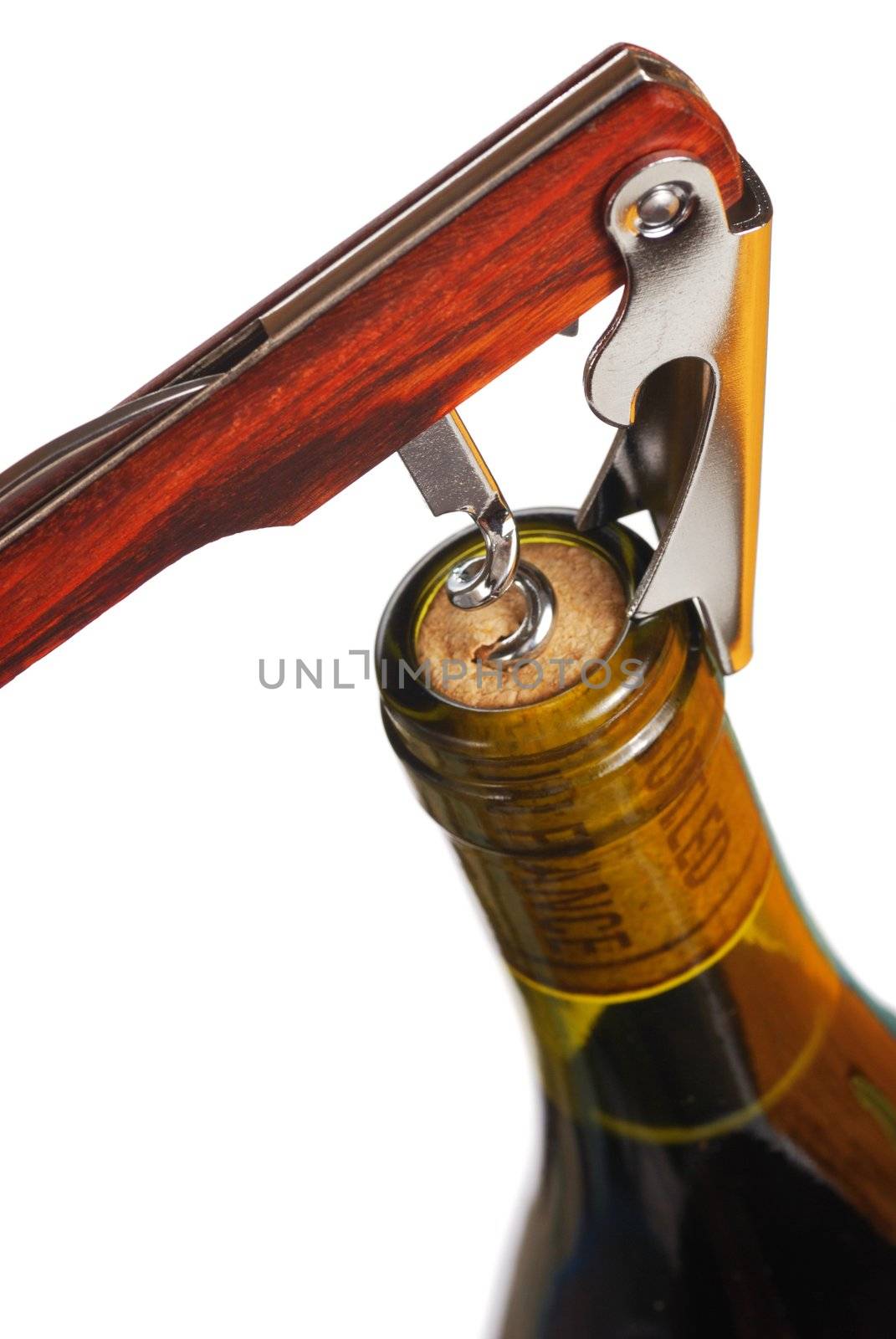 Opening a wine bottle with corkscrew, isolated on white