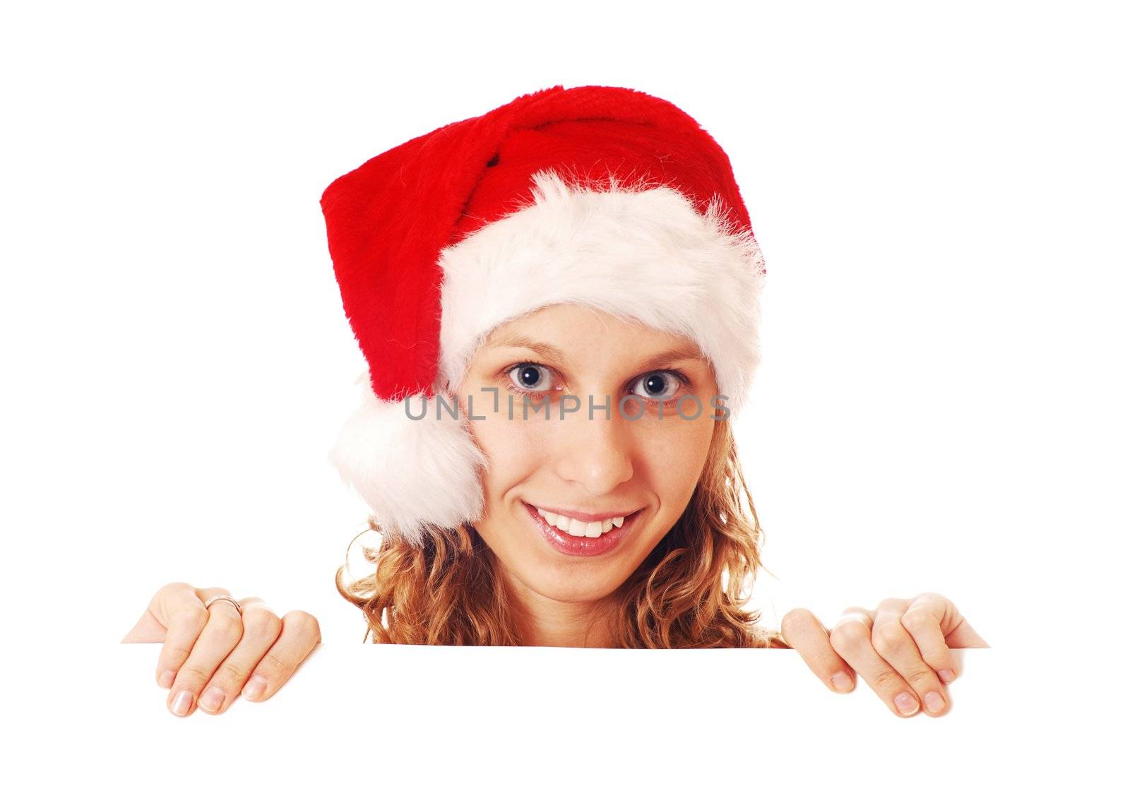 Girl in Santa's hat with a signboard, isolated on white